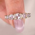 Half eternity band shines with diamonds across the top.
