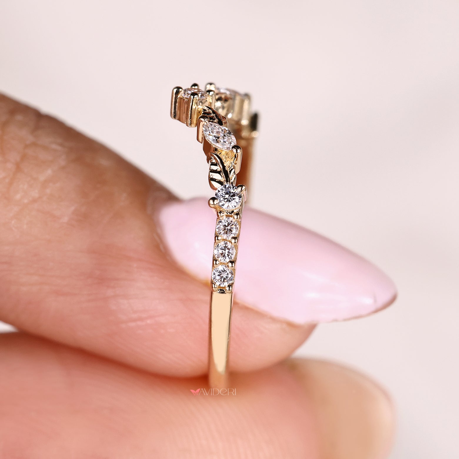 Handmade curved diamond band with marquise stone arrangement
