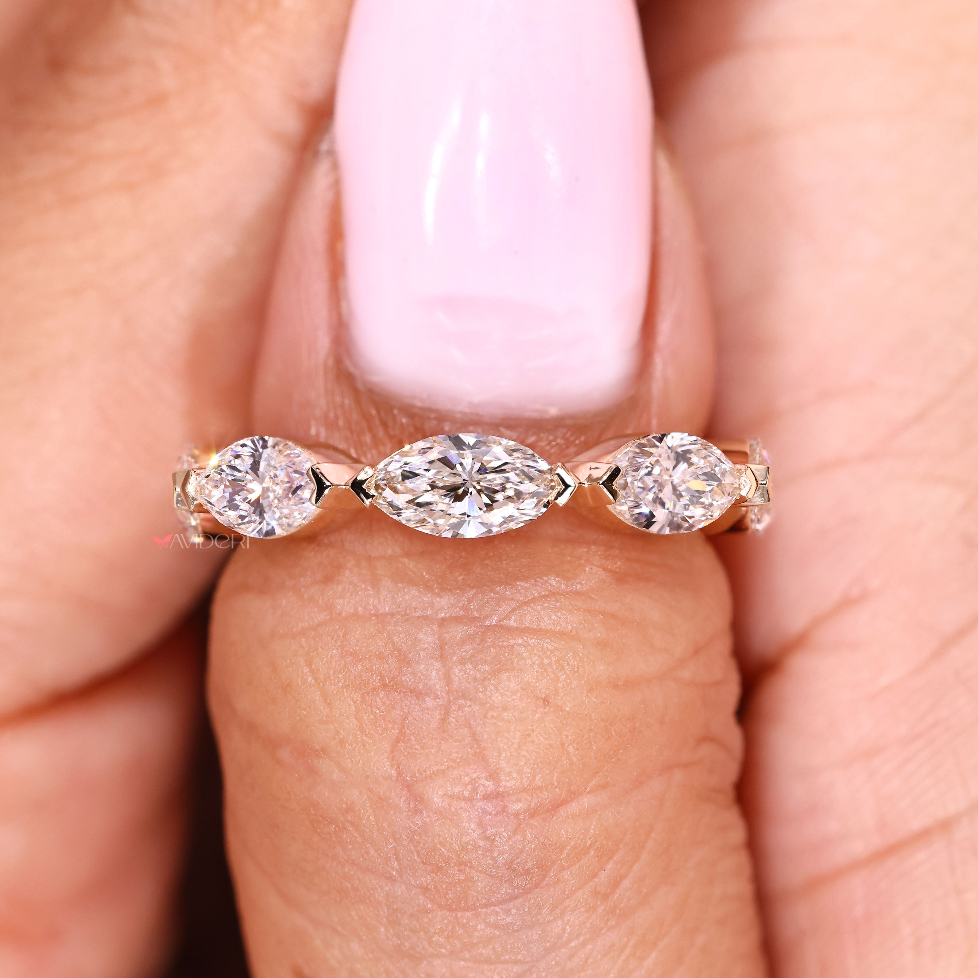 Handmade wedding band with marquise stones and V prongs
