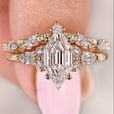 Hexagon diamond engagement ring with marquise and round wedding band

