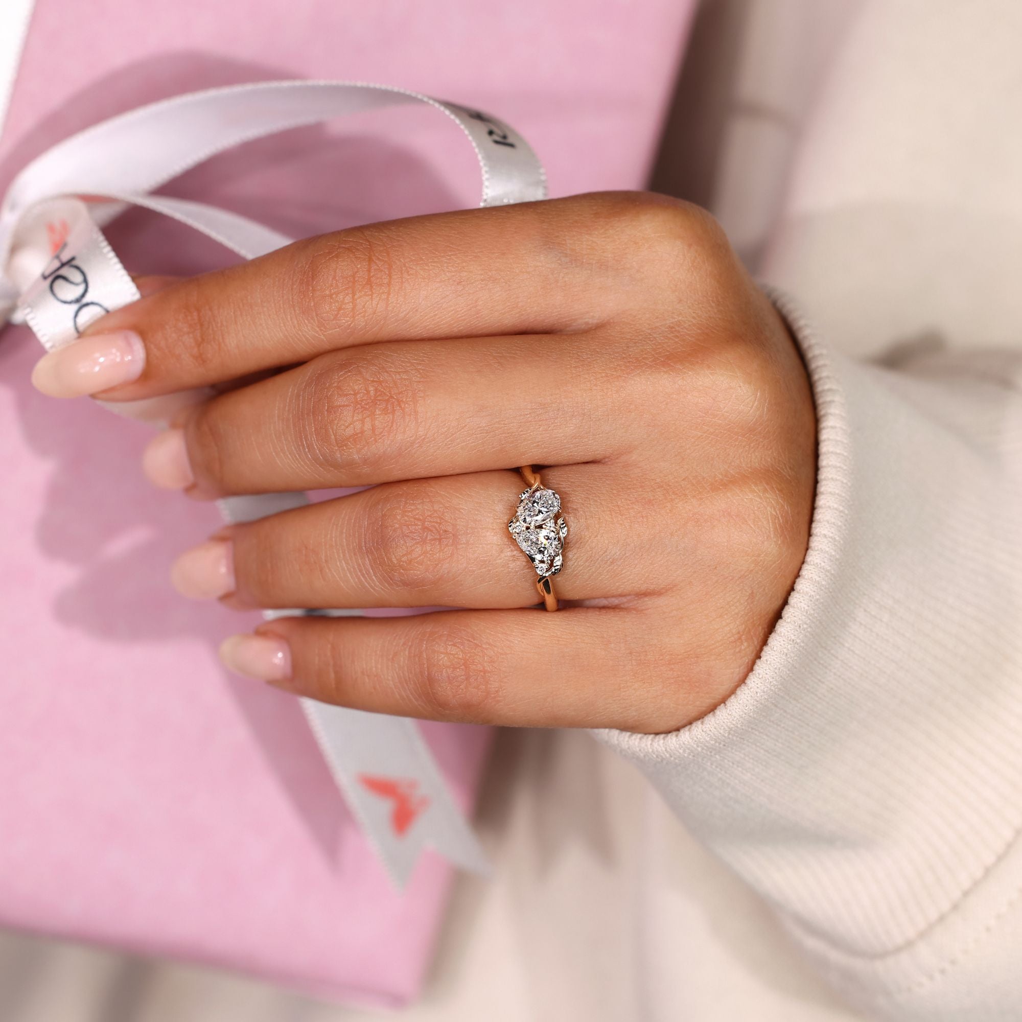 Toi et moi ring with pear oval and round diamonds.
