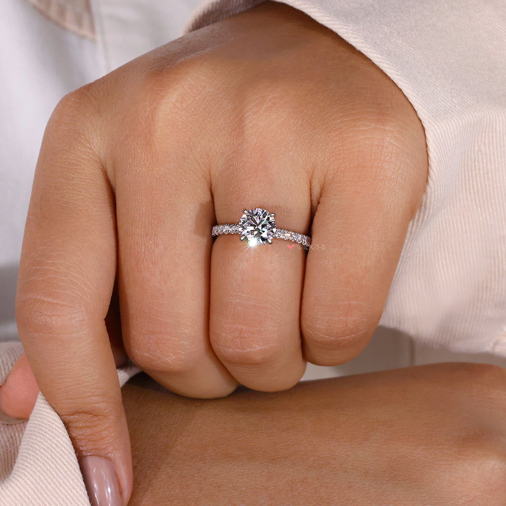 Hidden halo diamond ring crafted with precision, showcasing a round diamond surrounded by dazzling accents.
