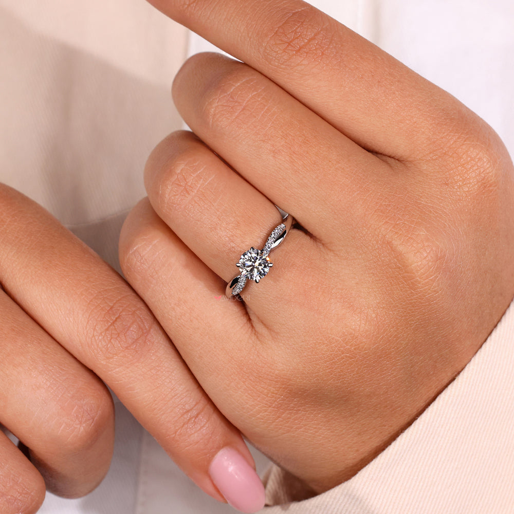 Round cut diamond ring with elegant handcrafted detailing for timeless style.
