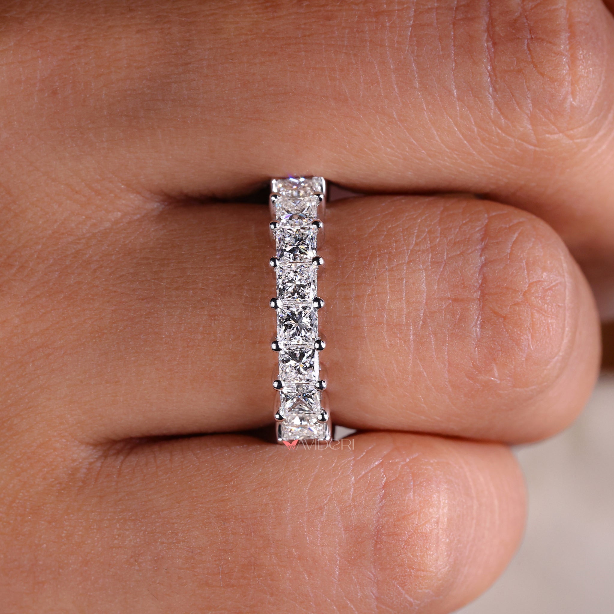 Prong setting band with securely held diamonds.
