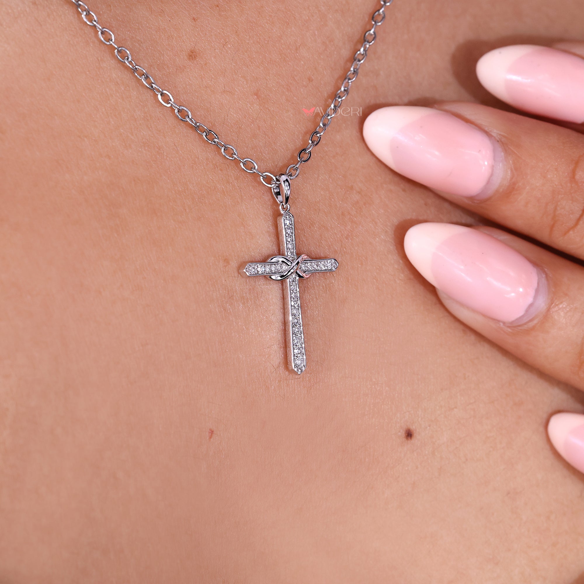 Lab grown diamond cross pendant necklace.