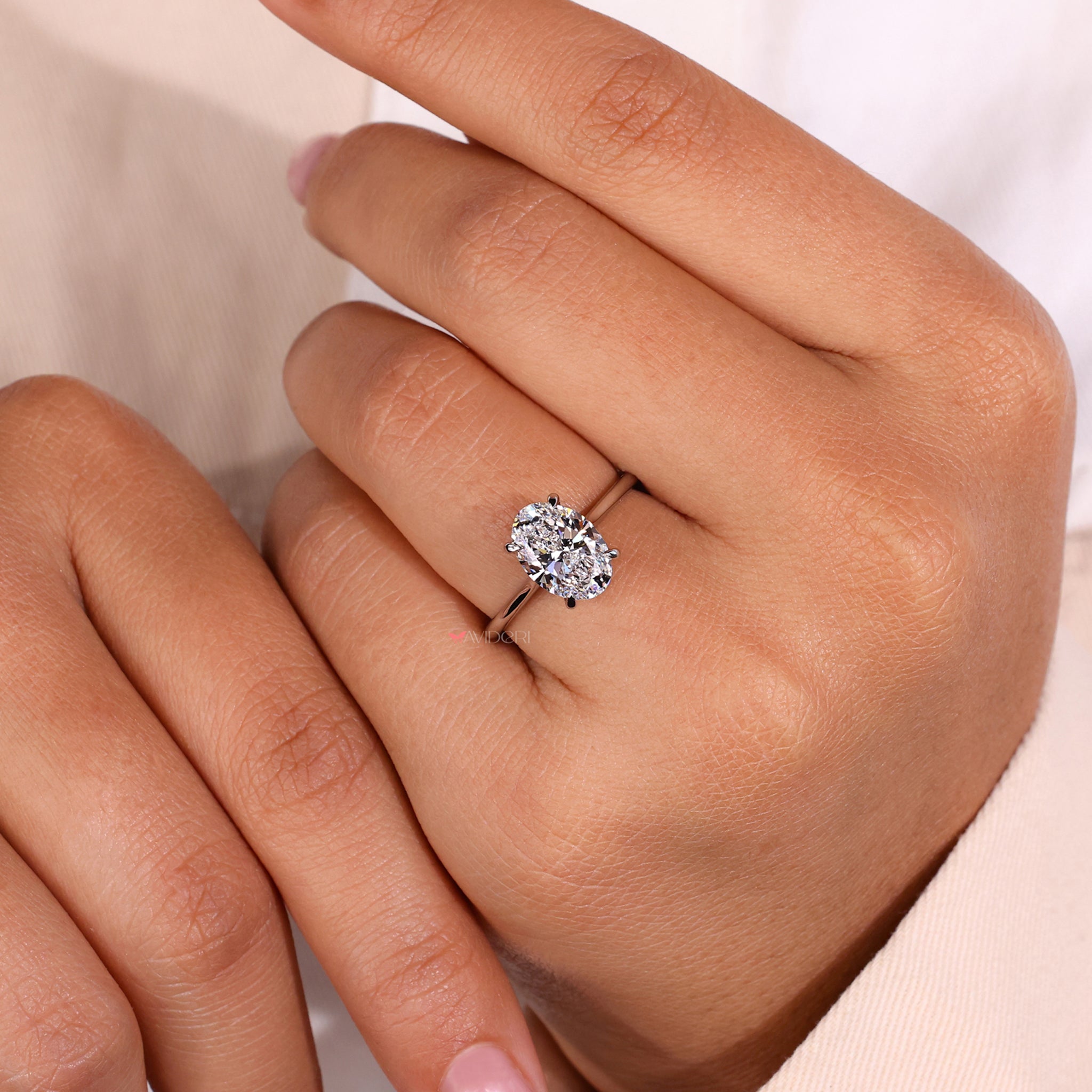 Solitaire diamond ring set in a cathedral setting ring for a regal appearance.
