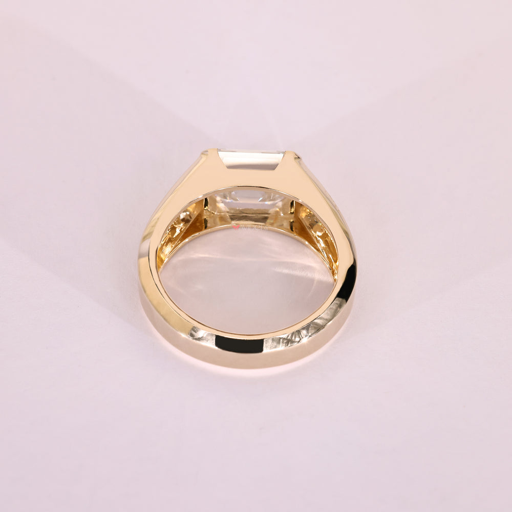 Tapered shank emerald moissanite men's ring.
