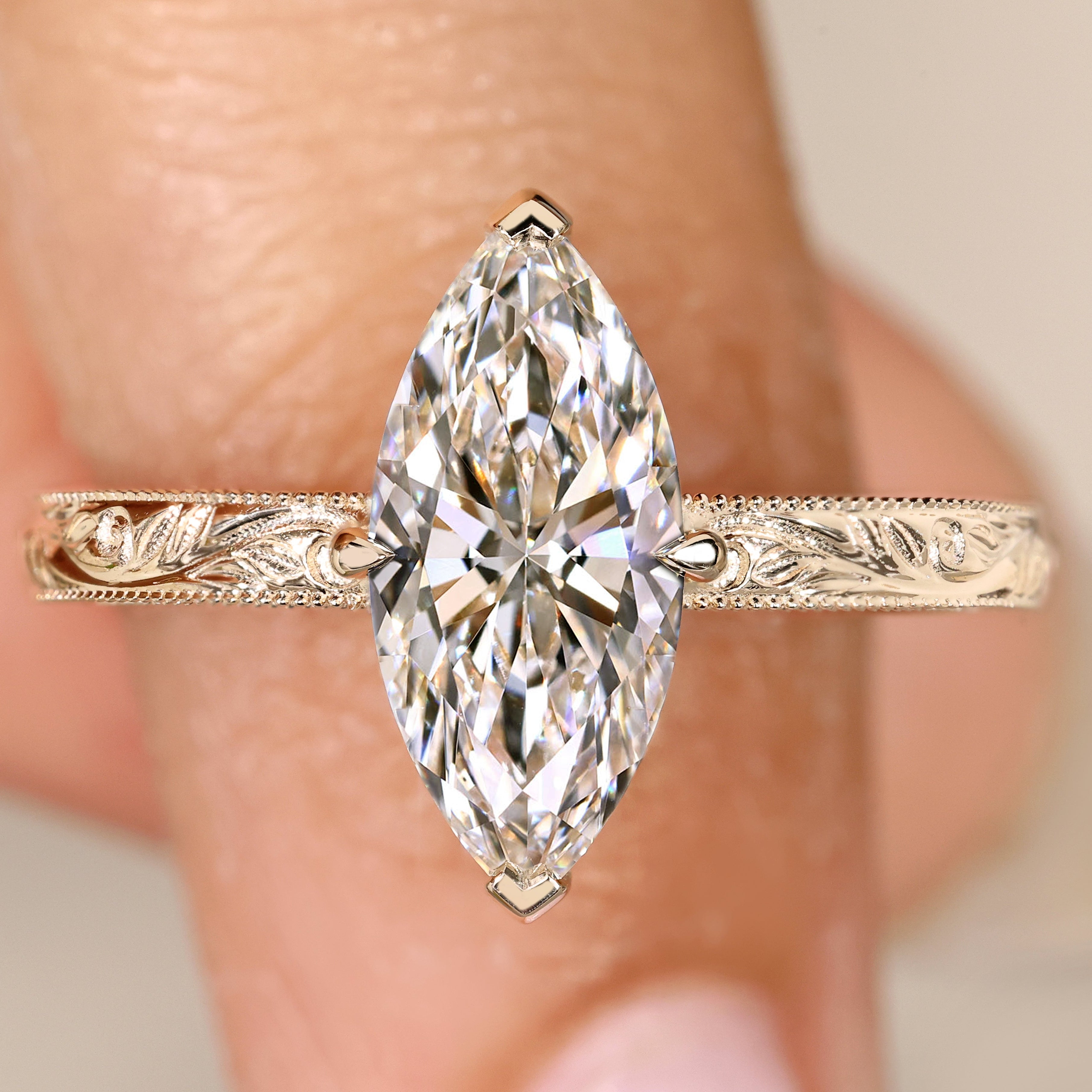 Marquise diamond ring with hidden round diamond halo.
