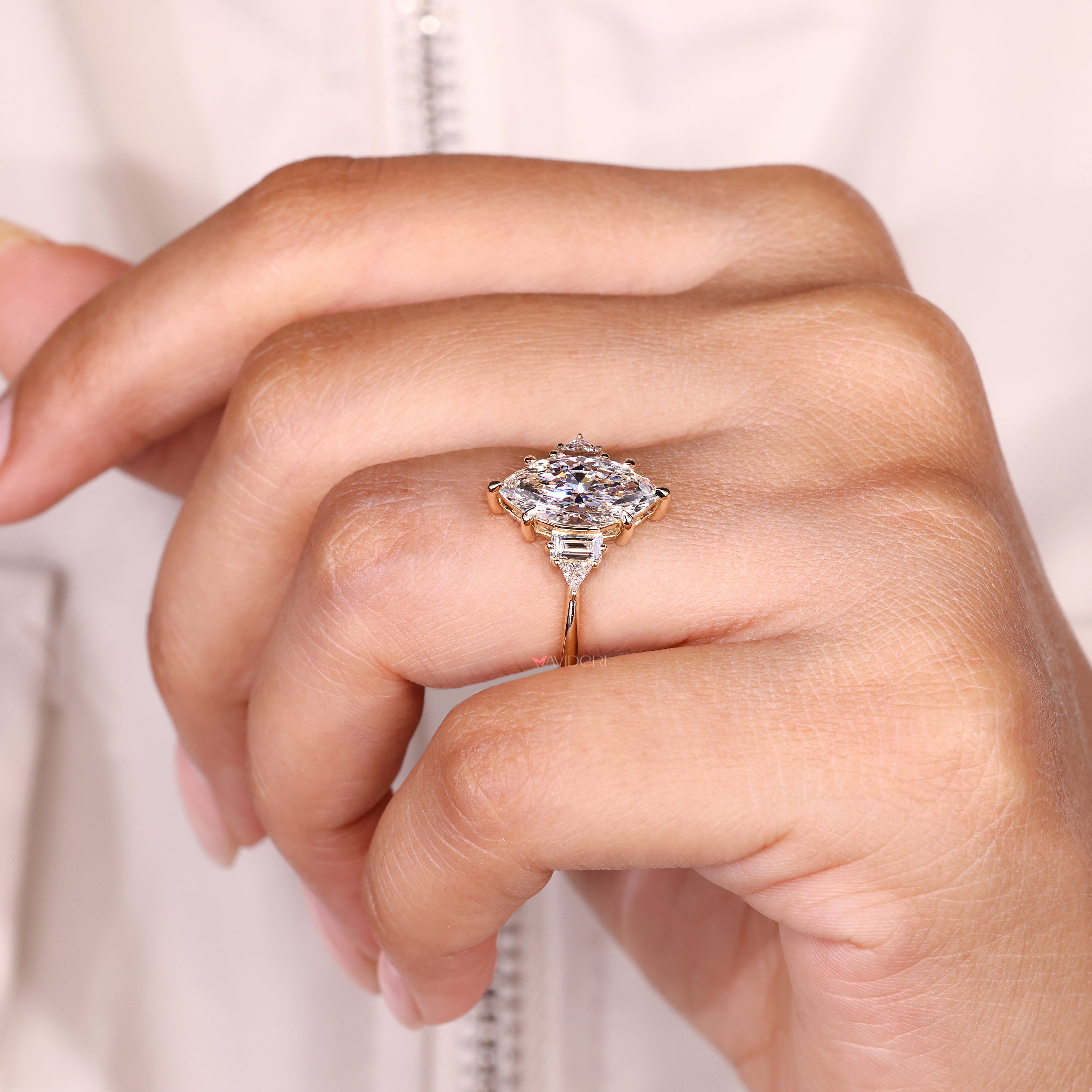 Handmade marquise diamond ring with basket style setting.
