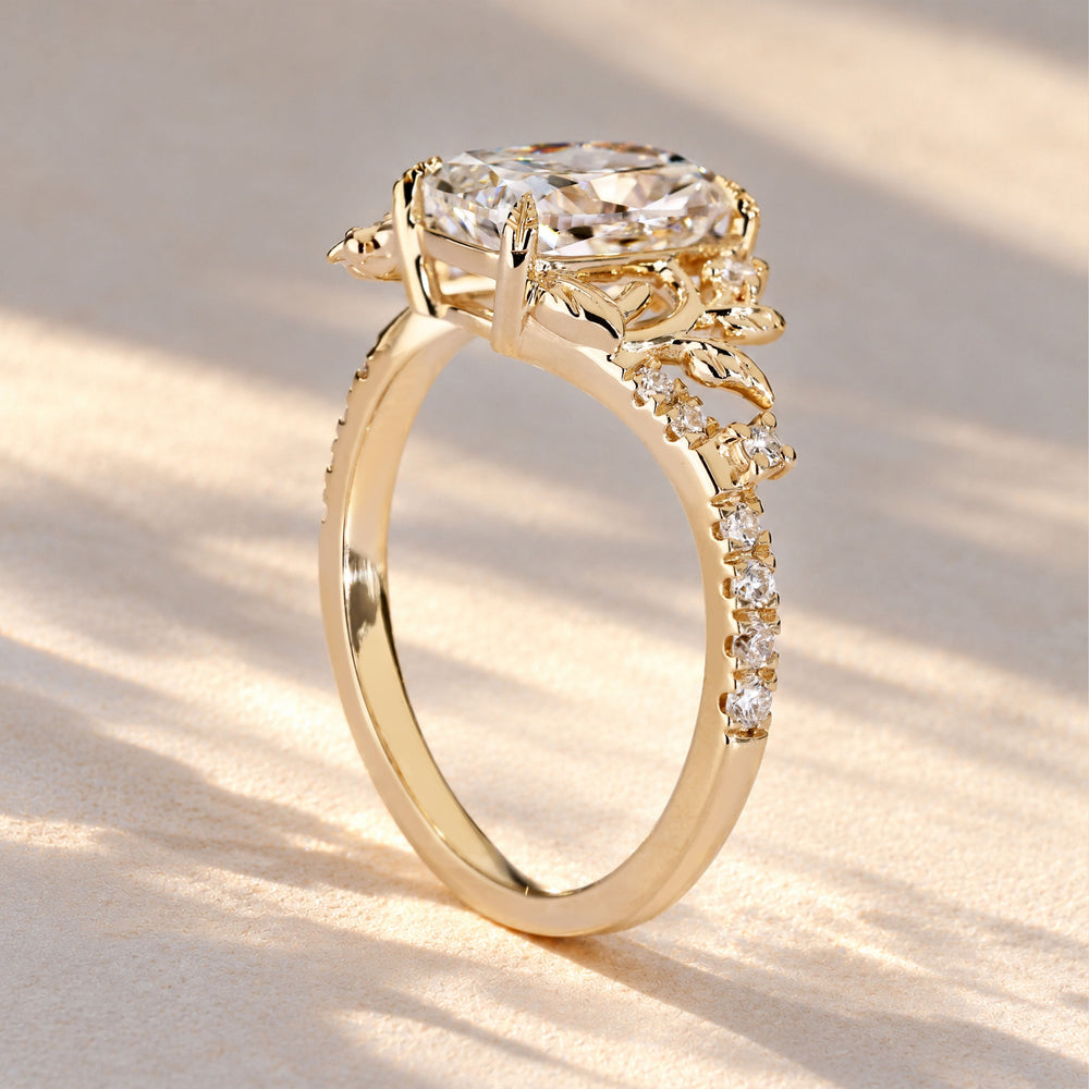 Lab grown oval diamond ring with round pave.
