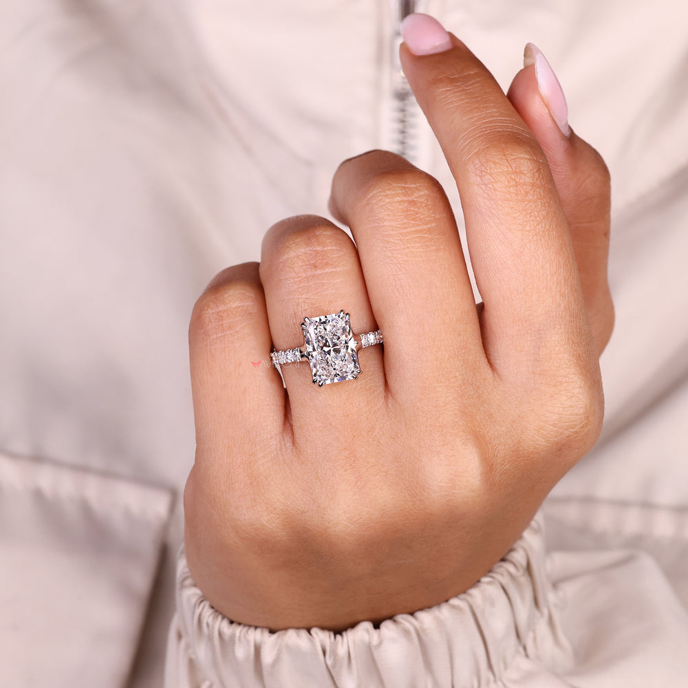Handmade radiant cut diamond ring with secure prong setting.
