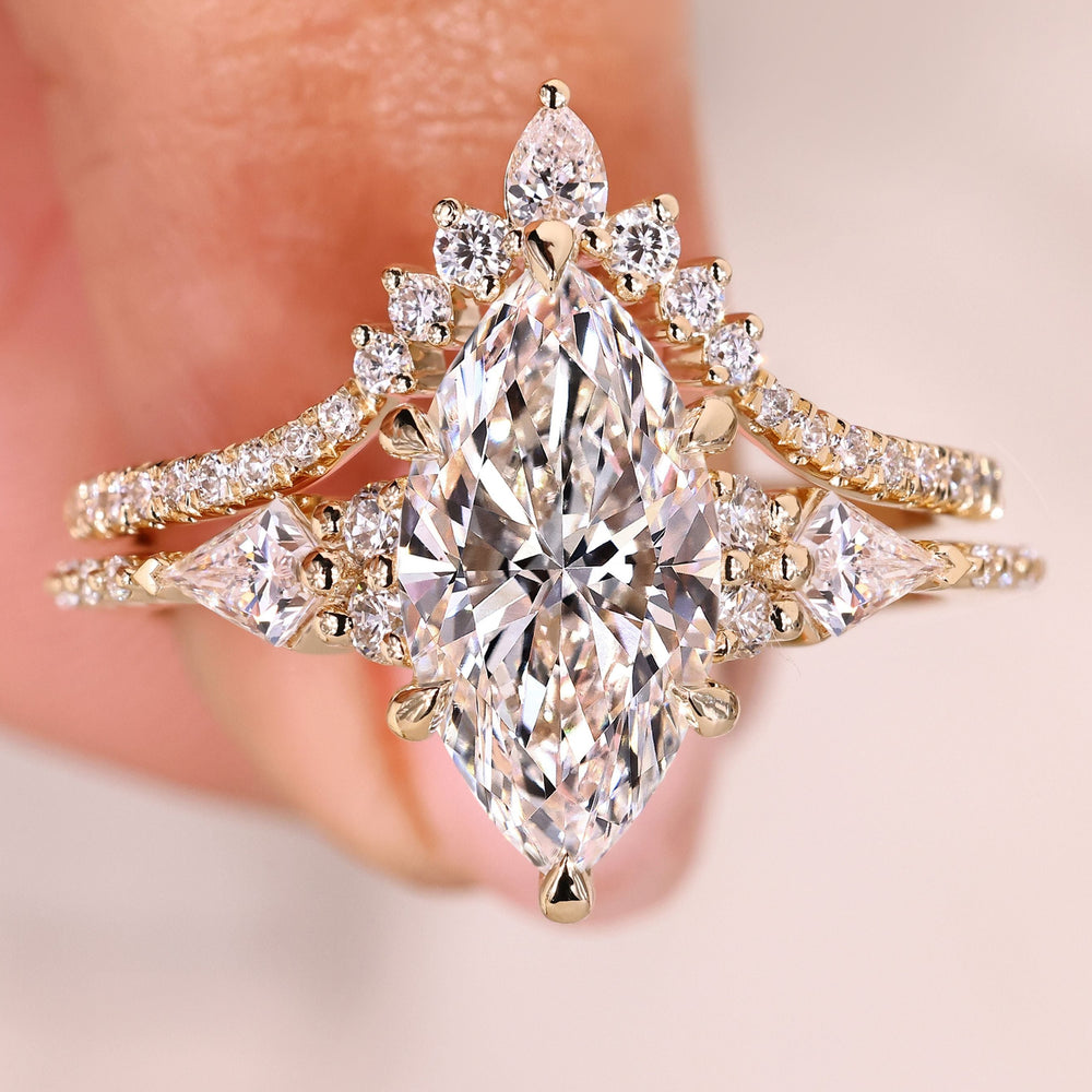Marquise diamond ring with chevron wedding band.
