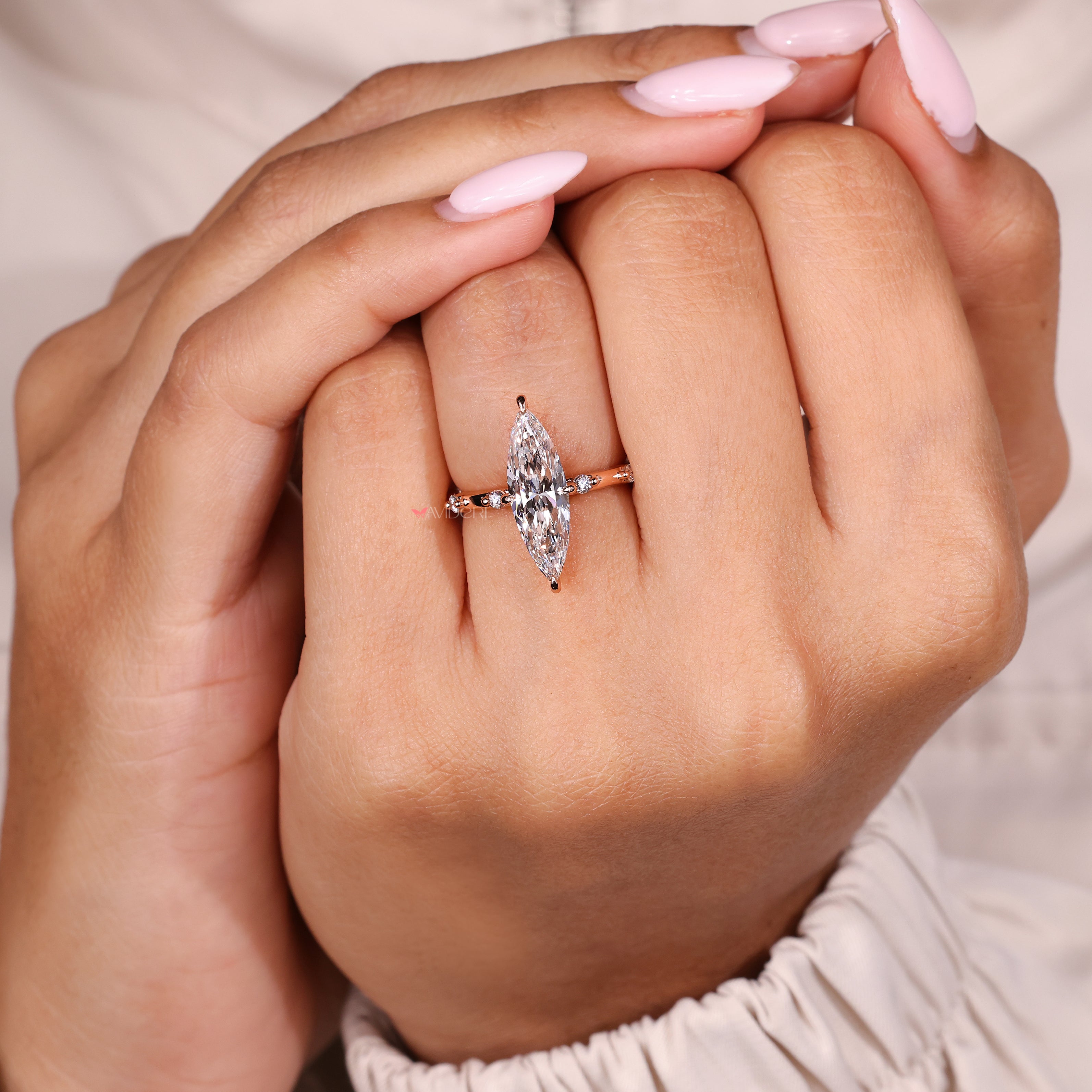 Marquise lab diamond ring with distant pave style details
