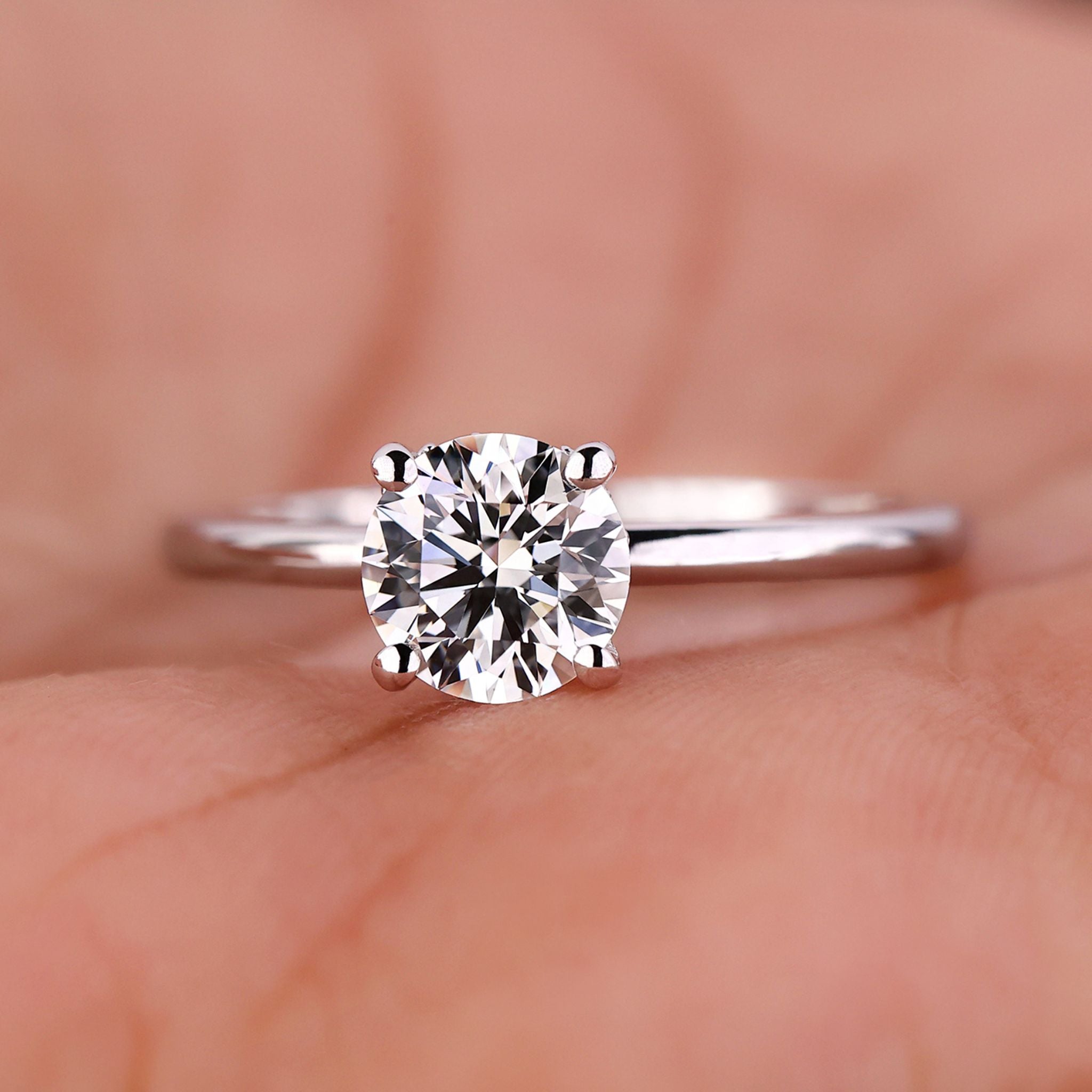2 ct round diamond engagement ring featuring a stunning hidden halo design in a handcrafted setting.