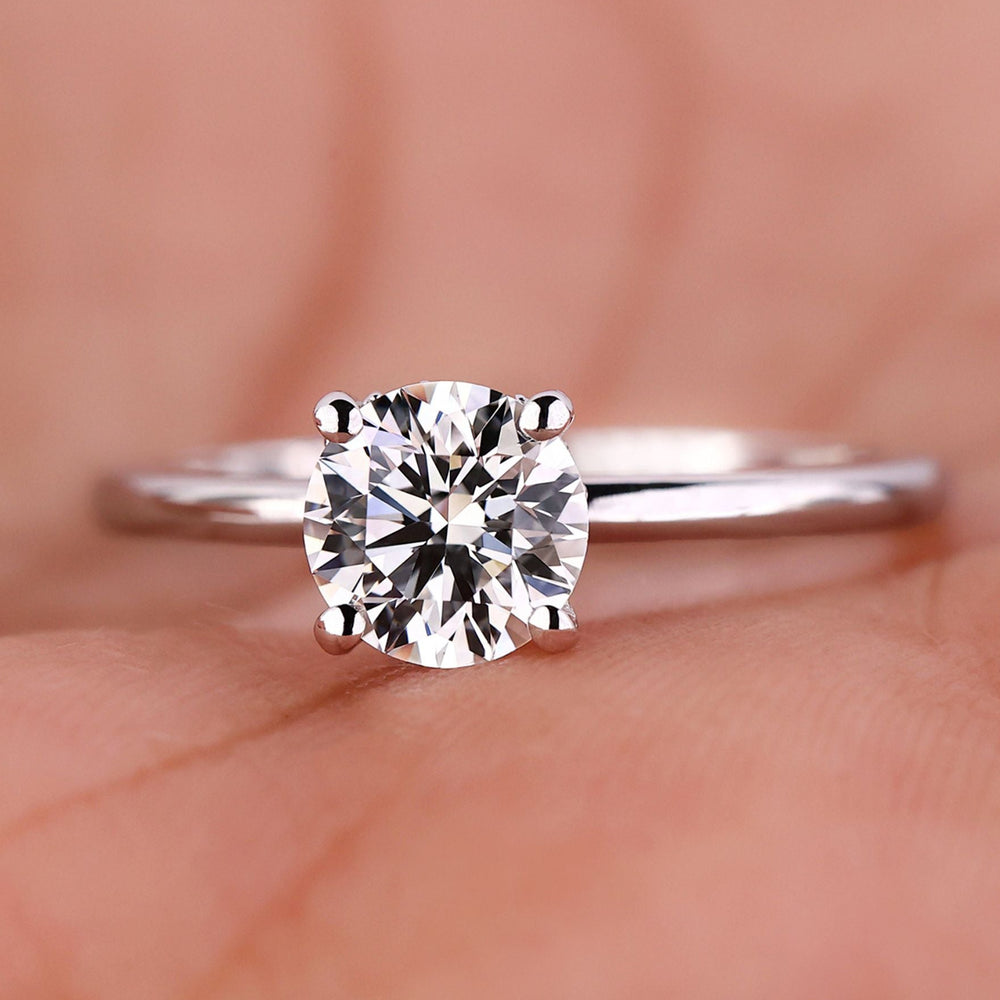 2 ct round diamond engagement ring featuring a stunning hidden halo design in a handcrafted setting.