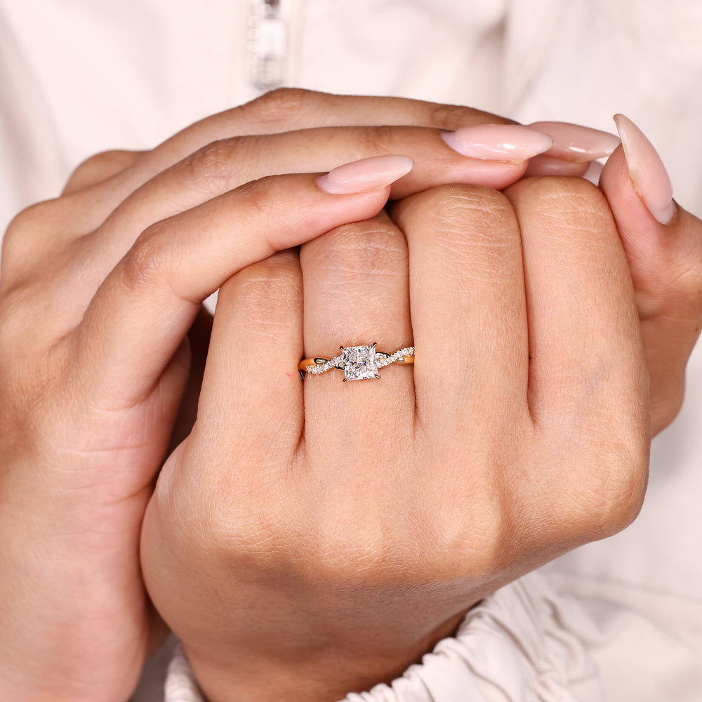 Engagement ring princess cut with pave style round stones
