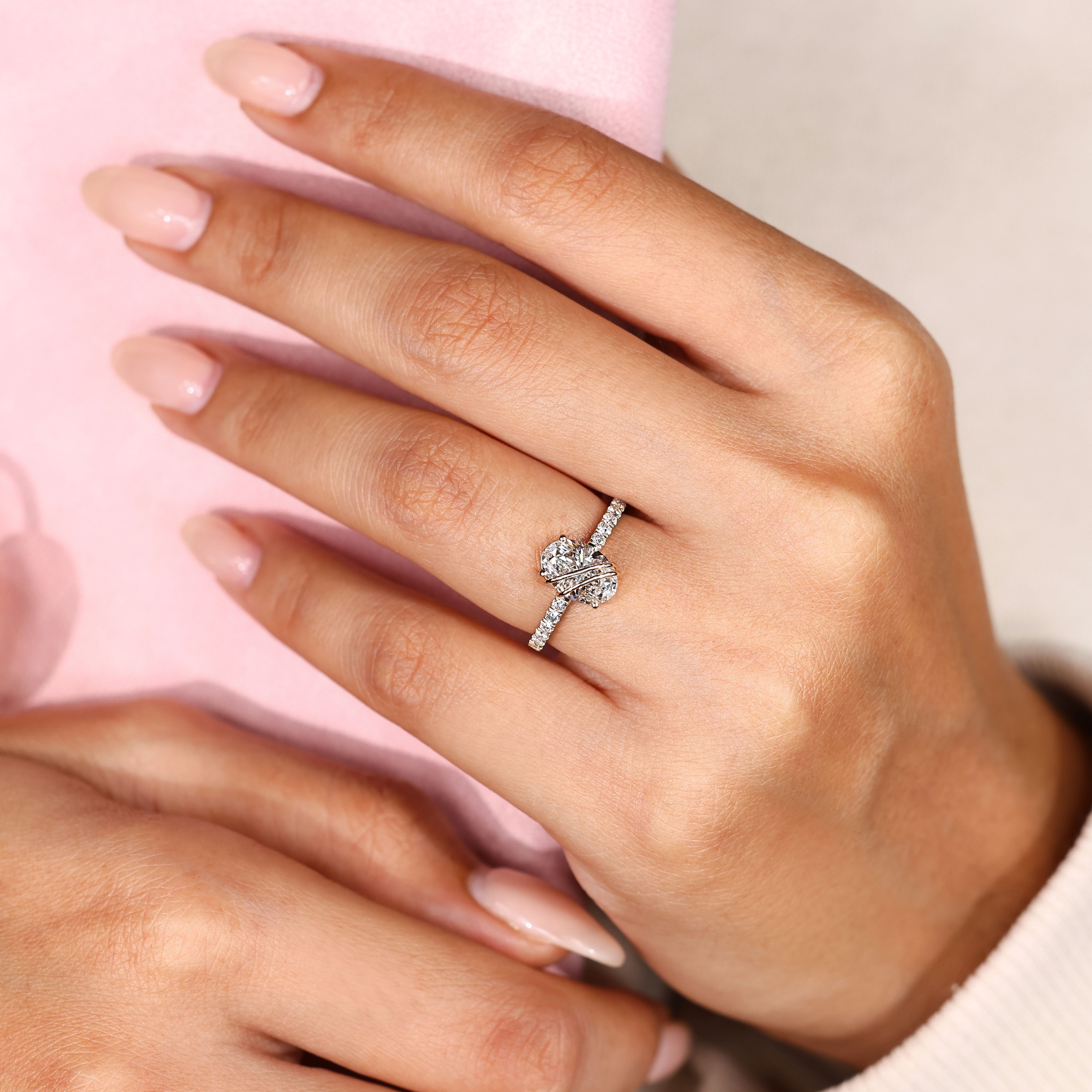 Pave oval engagement ring with round diamonds.
