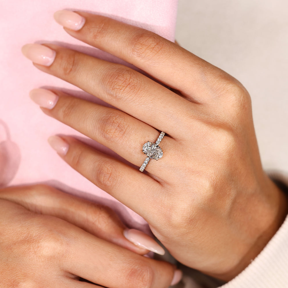 Pave oval engagement ring with round diamonds.
