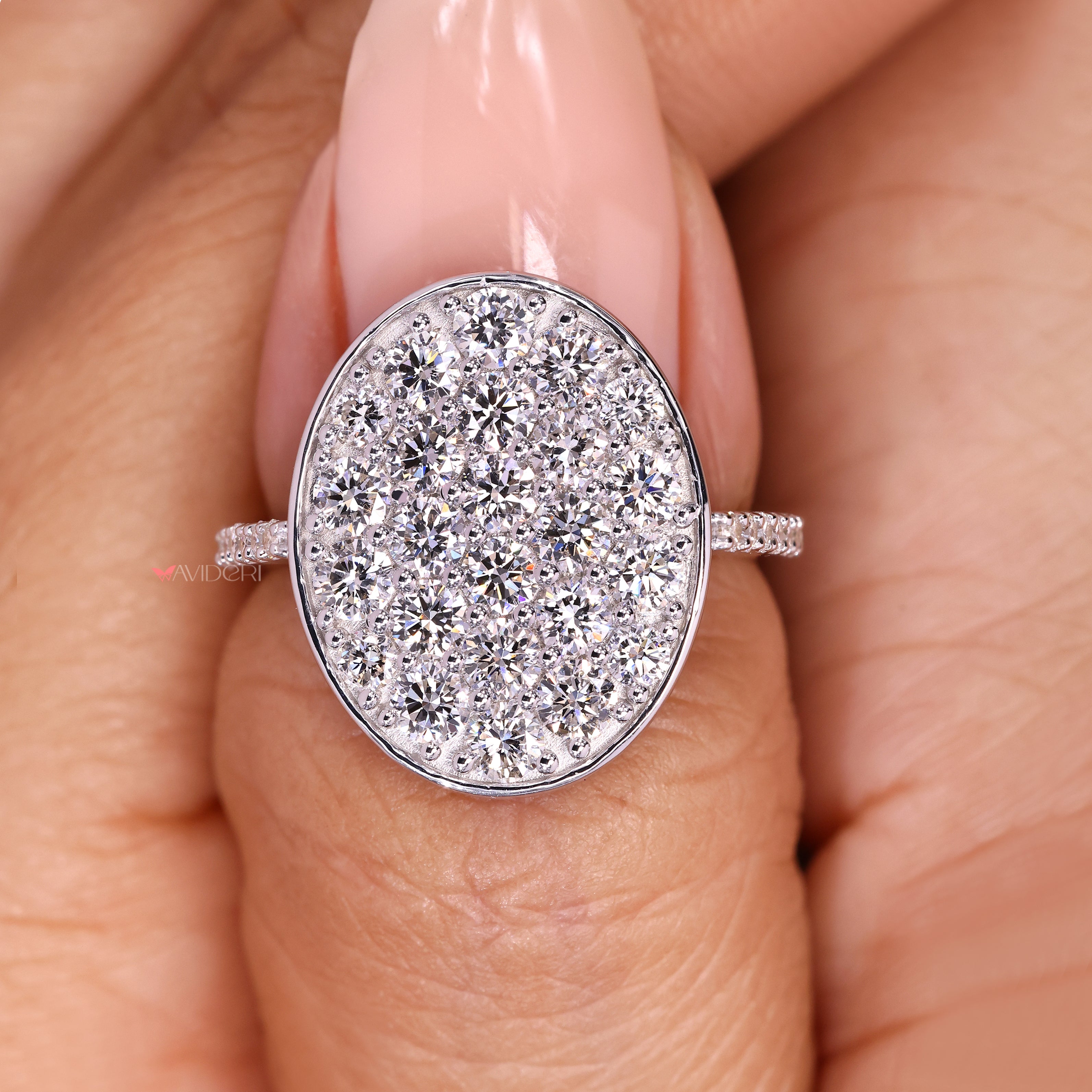 IGI certified round diamond cluster ring with pave details.
