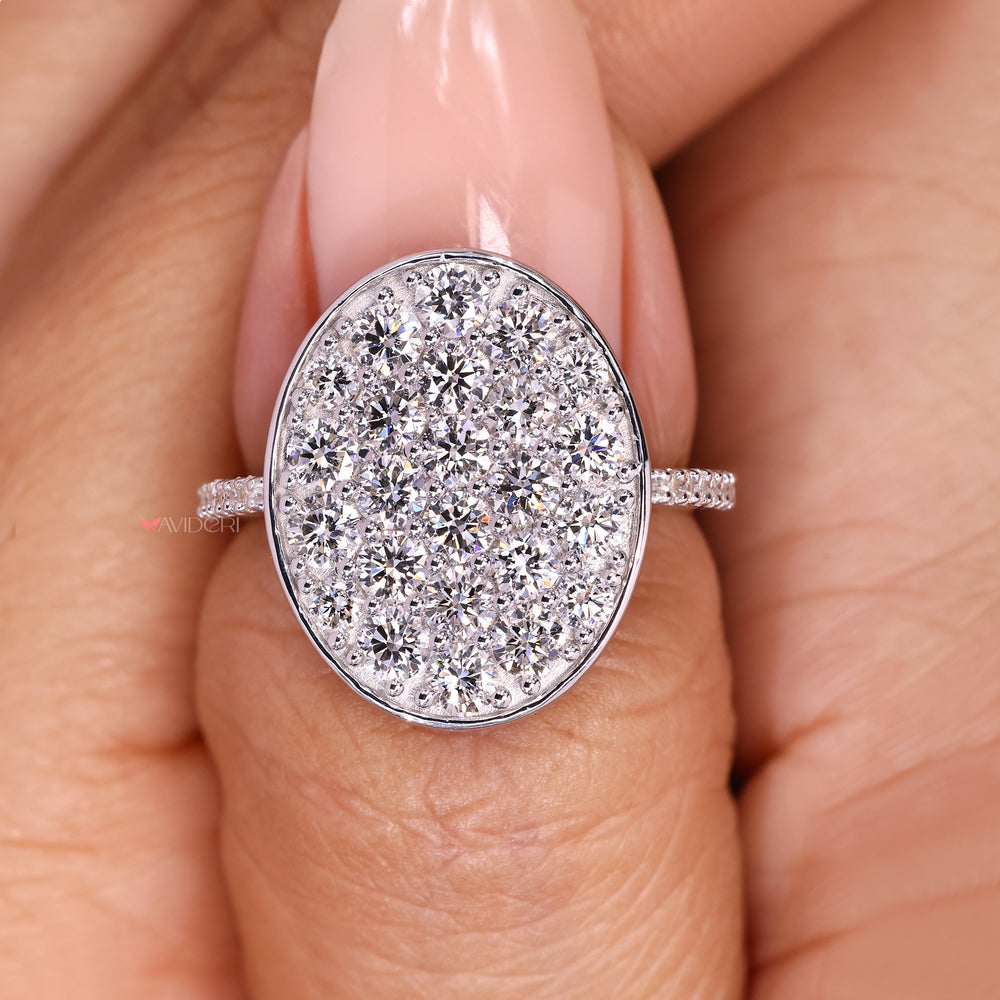 IGI certified round diamond cluster ring with pave details.
