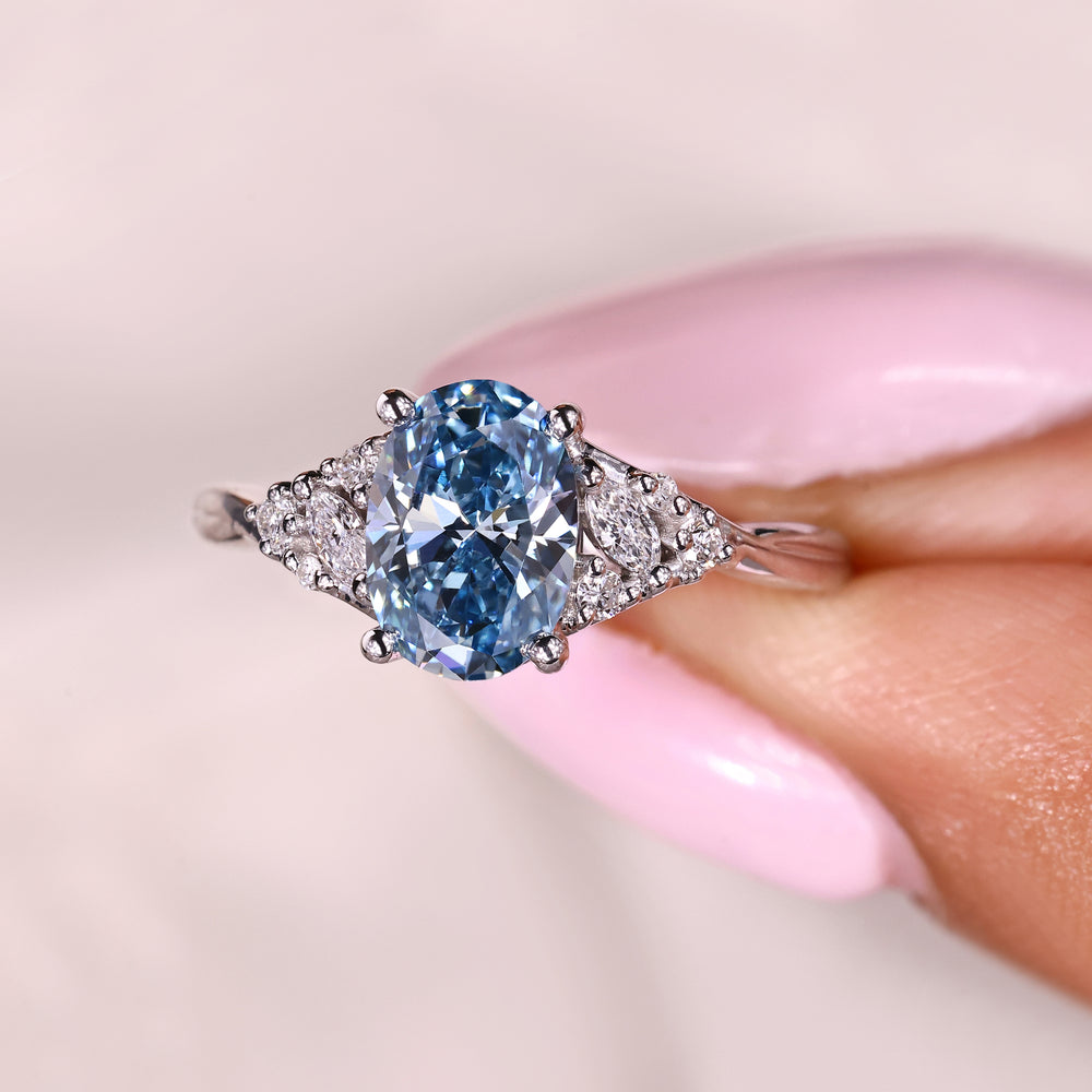Blue oval diamond ring twisted shank style.
