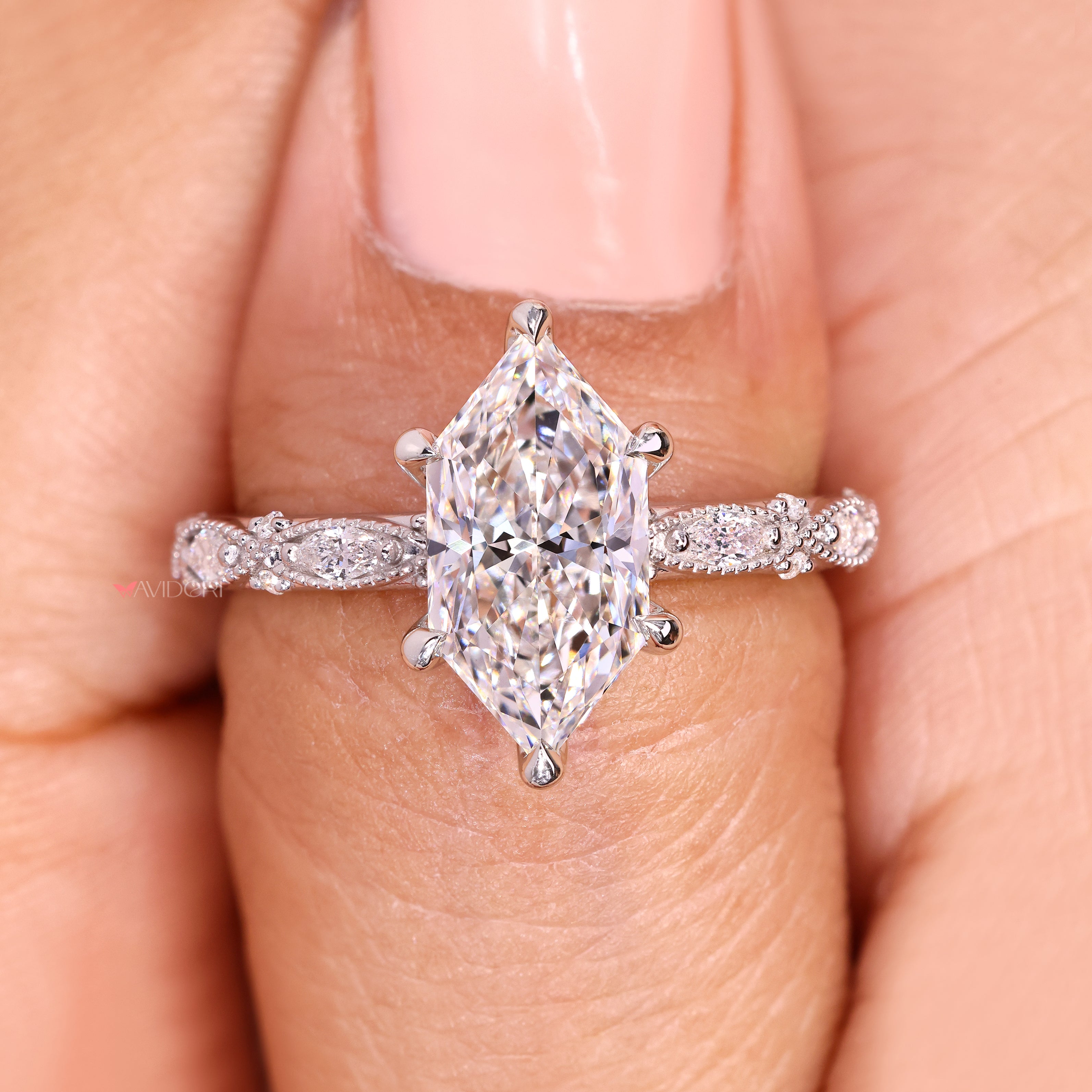 Vintage marquise diamond ring with six claw prong setting.

