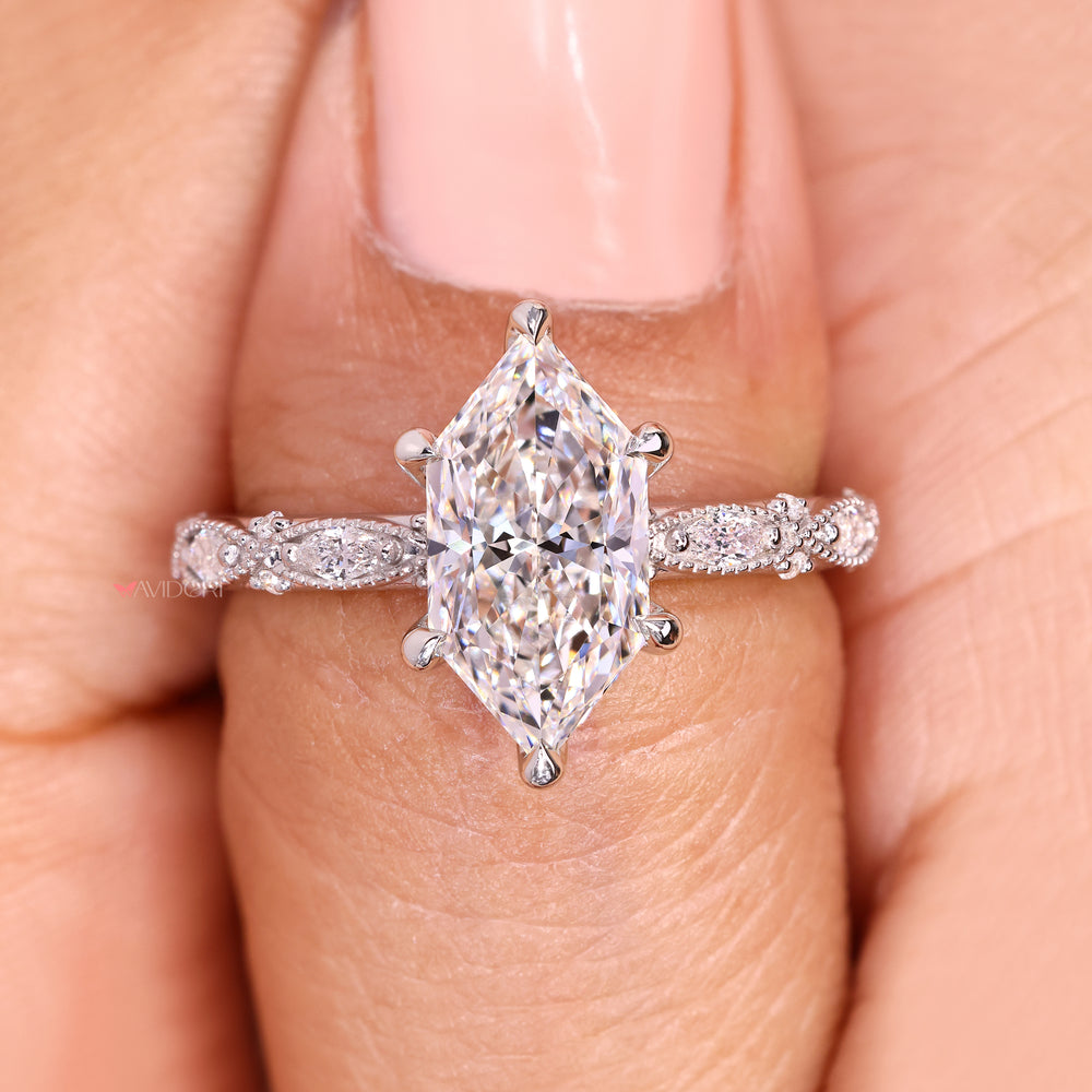 Vintage marquise diamond ring with six claw prong setting.
