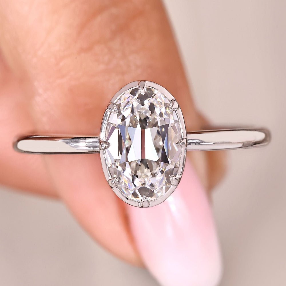 Solitaire diamond engagement ring with oval old European cut.