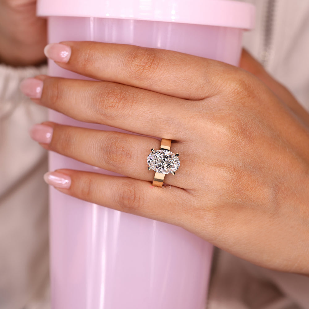 Oval ring with double sided pave round diamonds.
