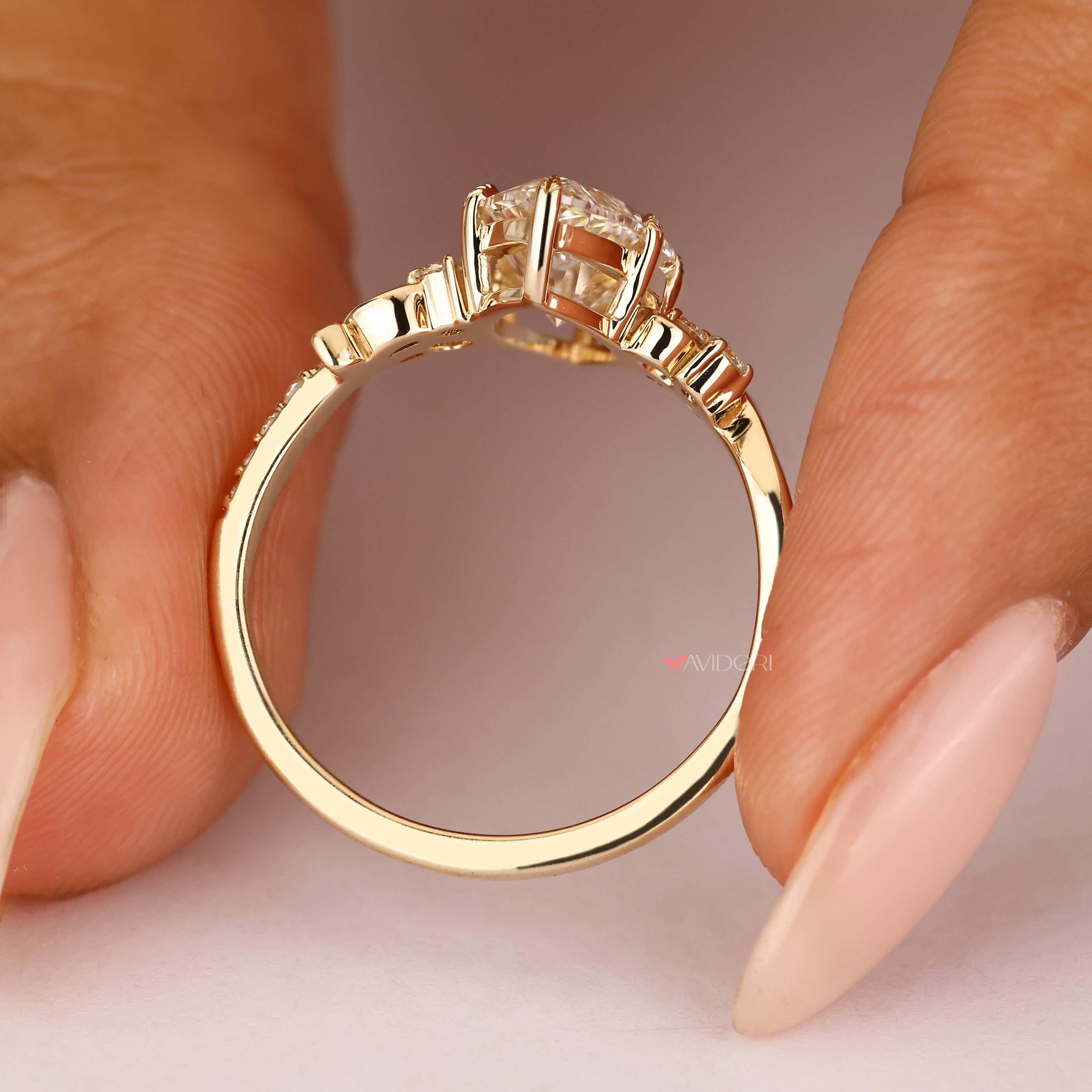 Fantasy ring with marquise center stone and round accents
