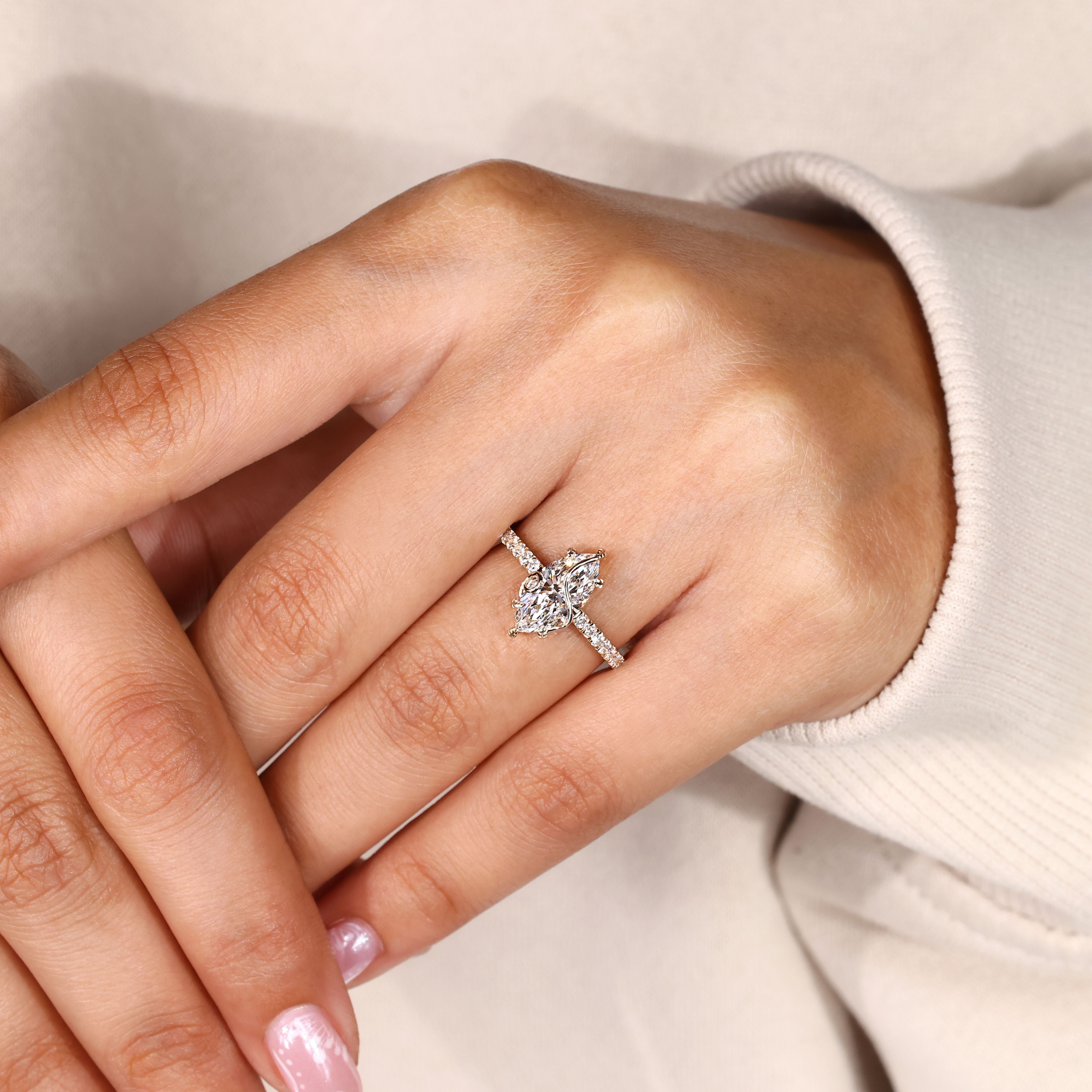 Handmade marquise diamond ring with leaf prongs.
