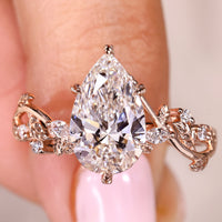 Nature Inspired Pear Shaped Diamond Ring With Side Stone