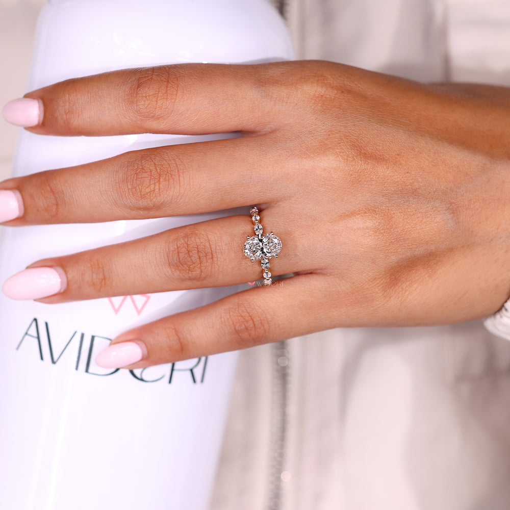Lab grown oval diamond ring with marquise and rounds
