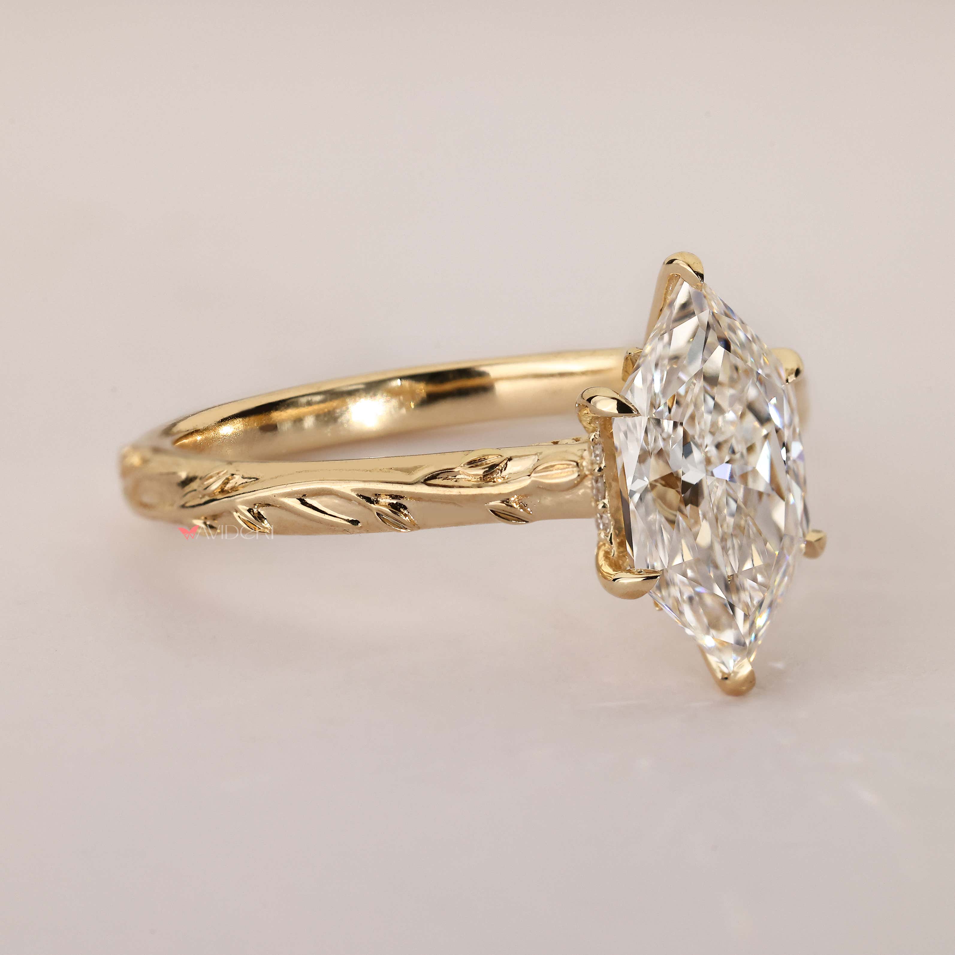 Handmade Dutch marquise diamond ring with halo.
