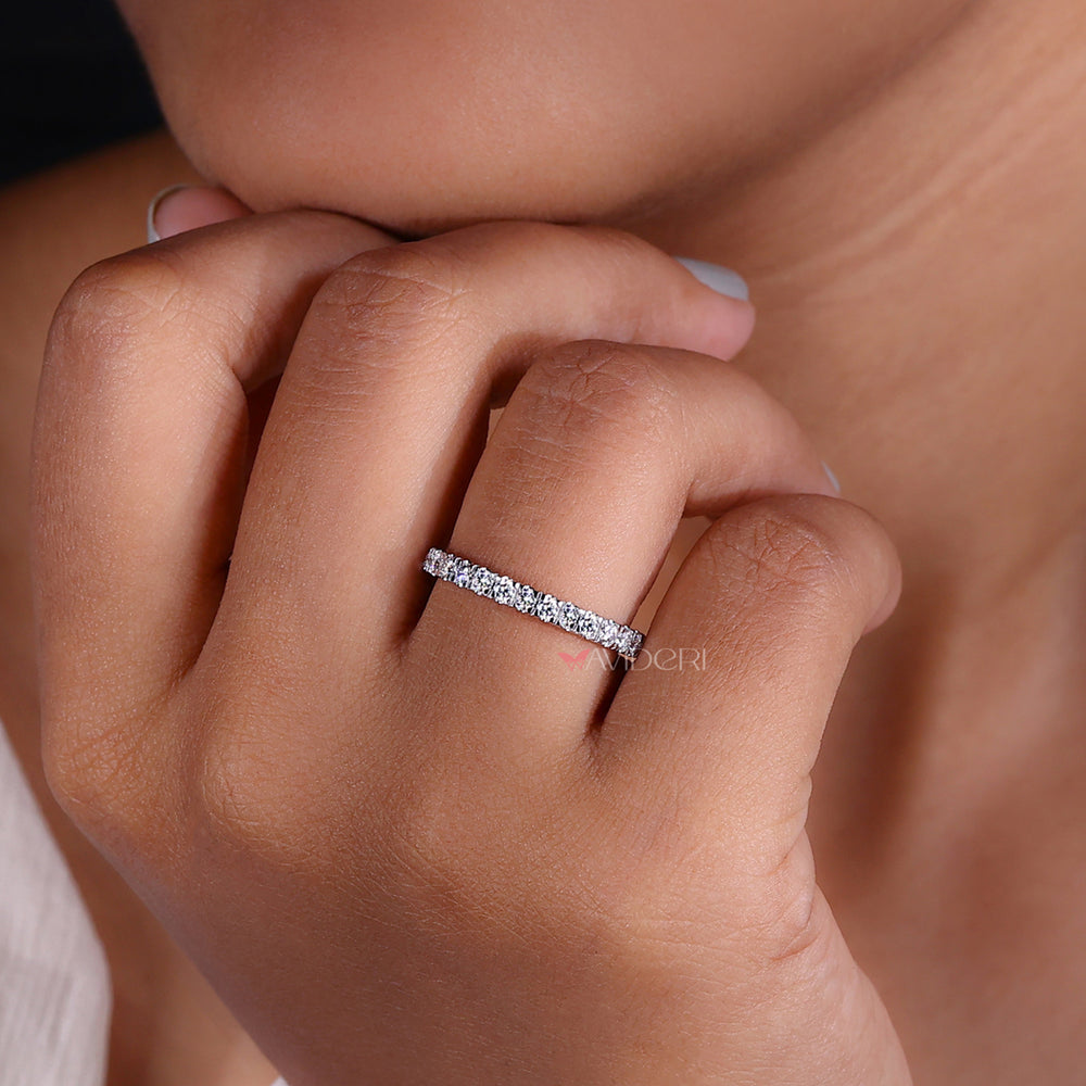 Round diamond wedding band with a refined design.
