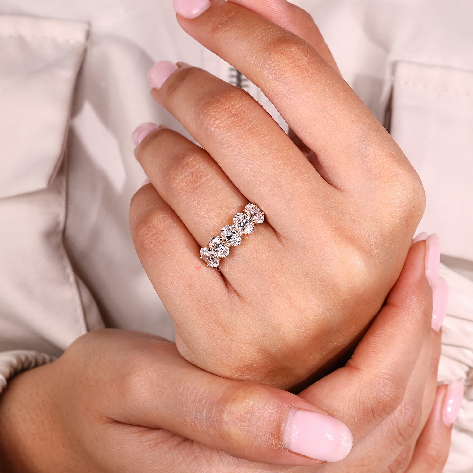 Handmade band with oval diamonds.