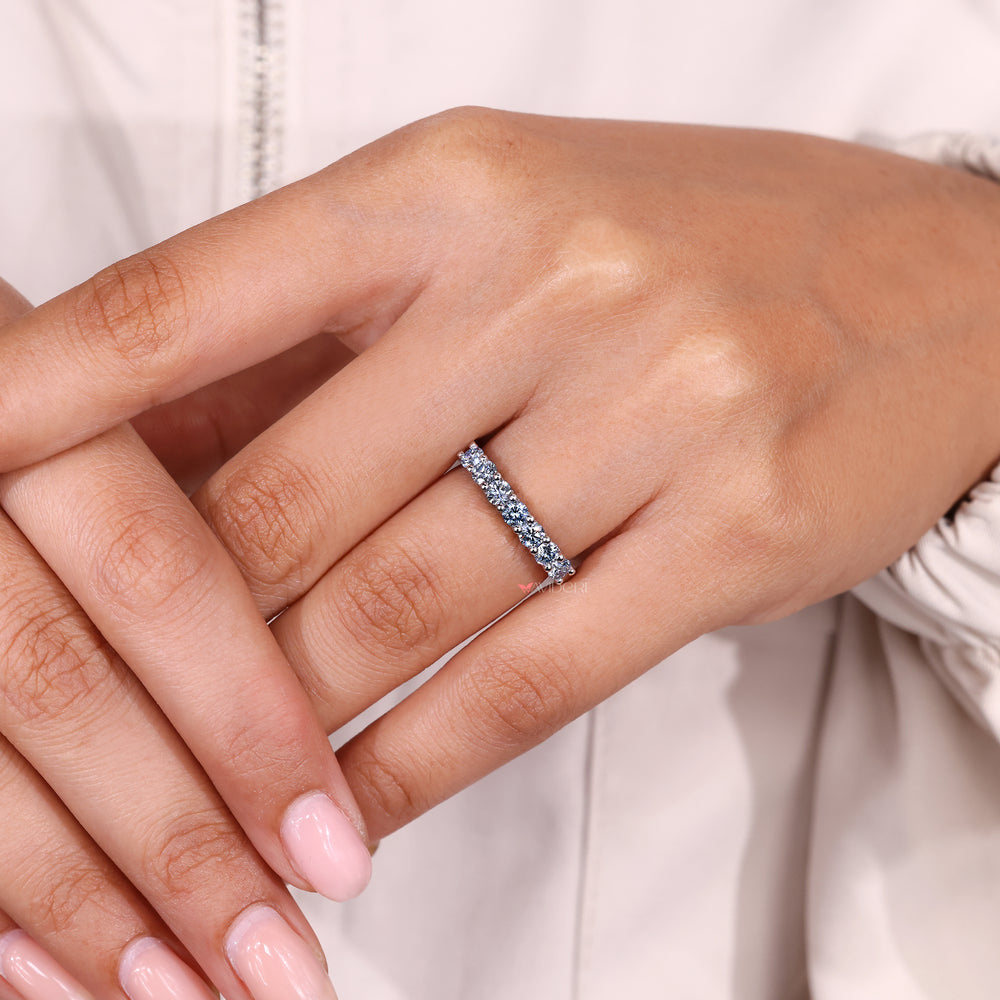 Shared prong setting with blue diamond wedding band.