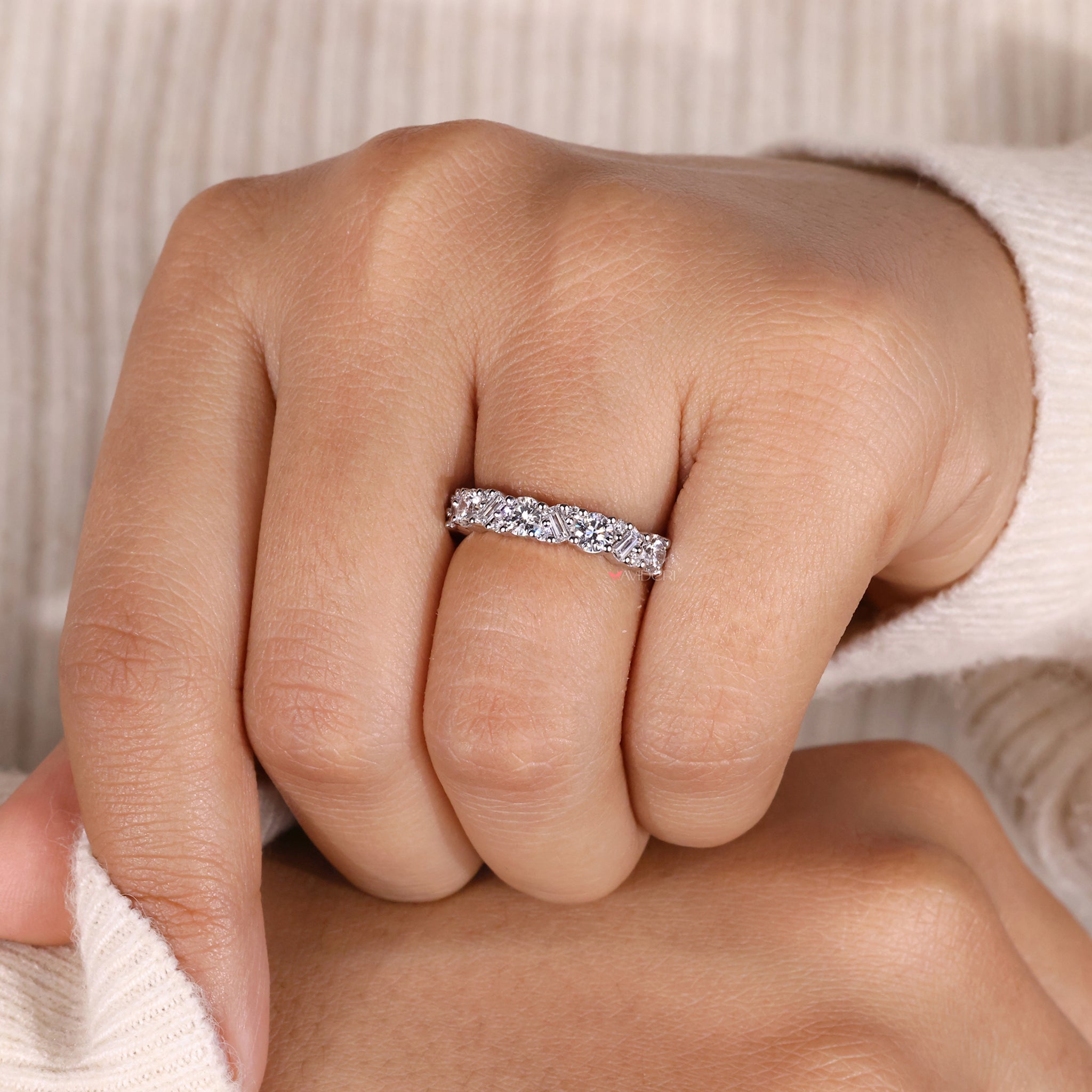 Round cut diamond wedding band with fine detail.
