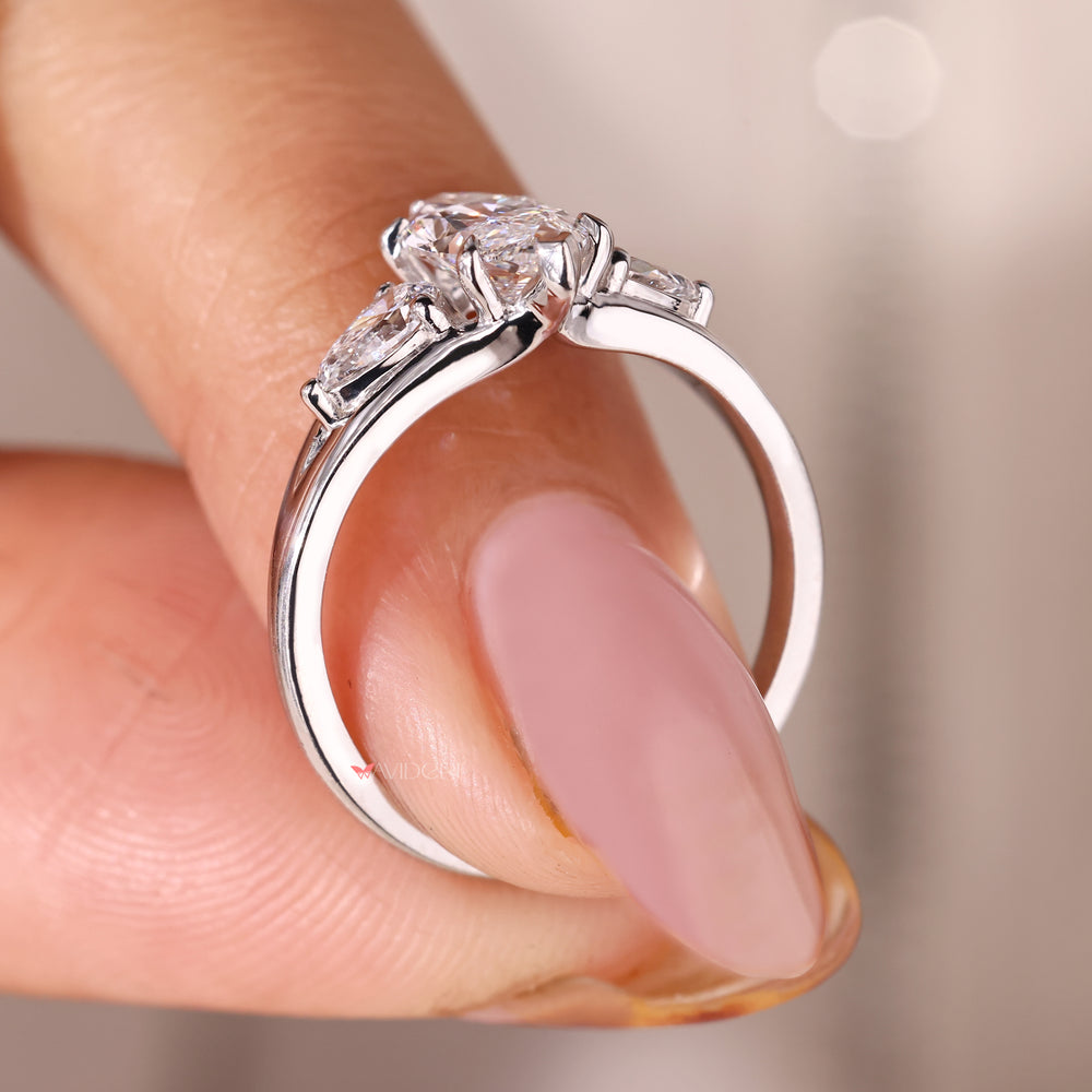 White gold diamond ring with marquise and pear stones.
