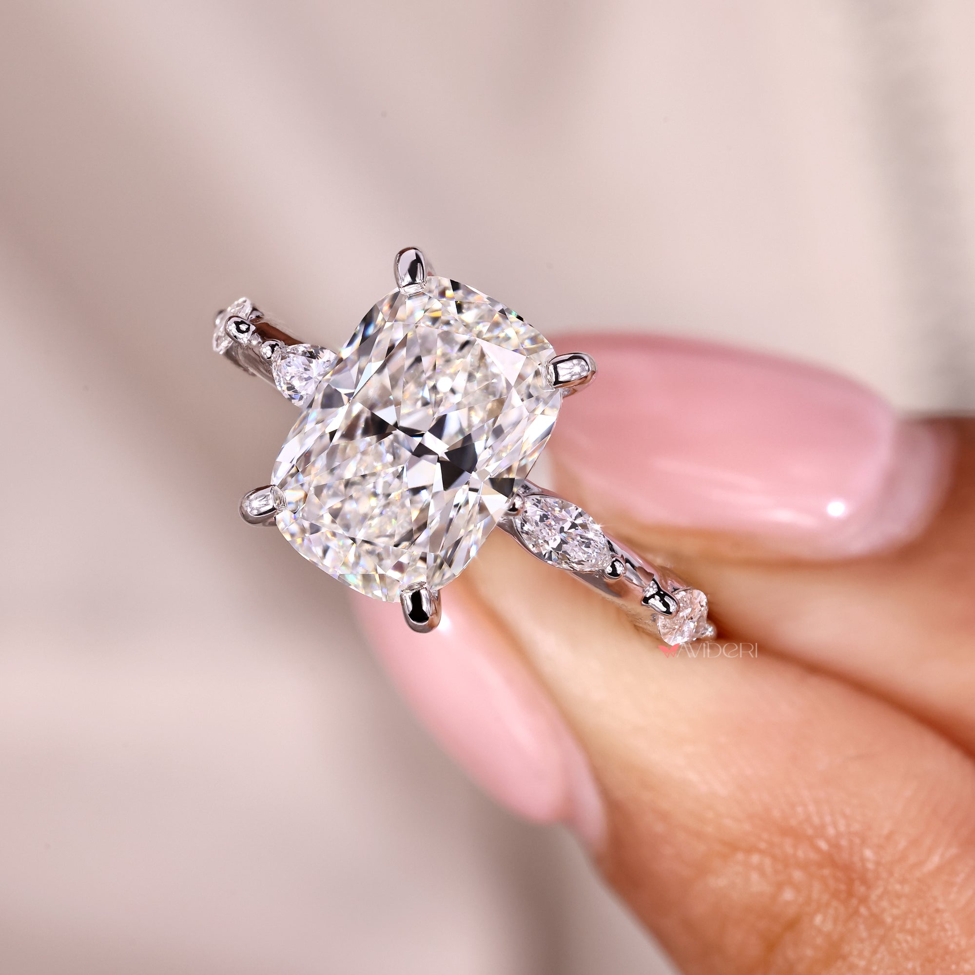 Custom diamond ring made with an elongated cushion center.