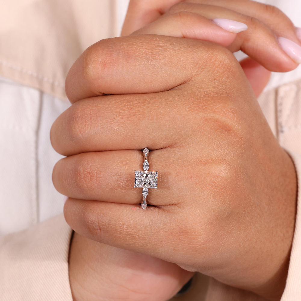 Handmade ring featuring a radiant engagement ring with a unique design.
