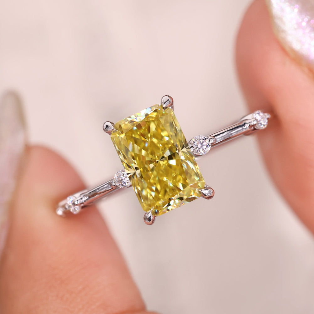 This canary yellow moissanite ring shines beautifully in the light.