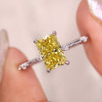 This canary yellow moissanite ring shines beautifully in the light.