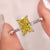 This canary yellow moissanite ring shines beautifully in the light.