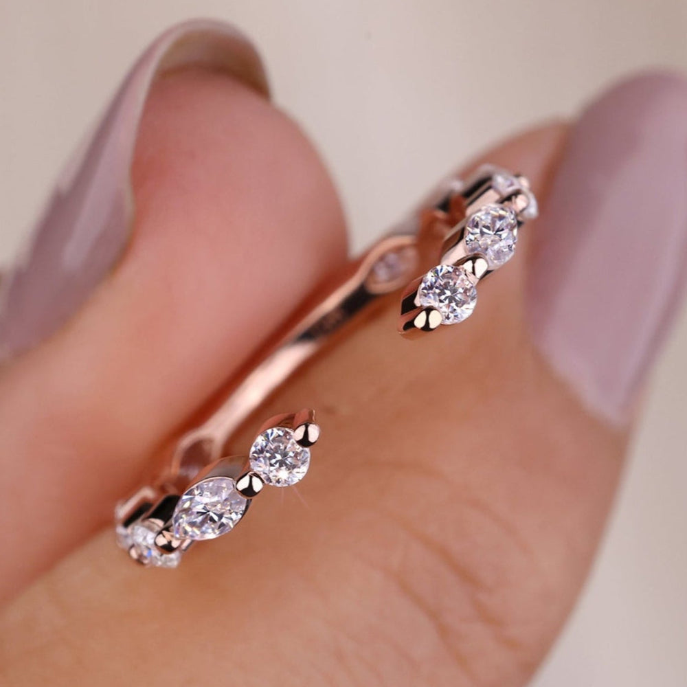 Open gap wedding band with modern design in rose gold.
