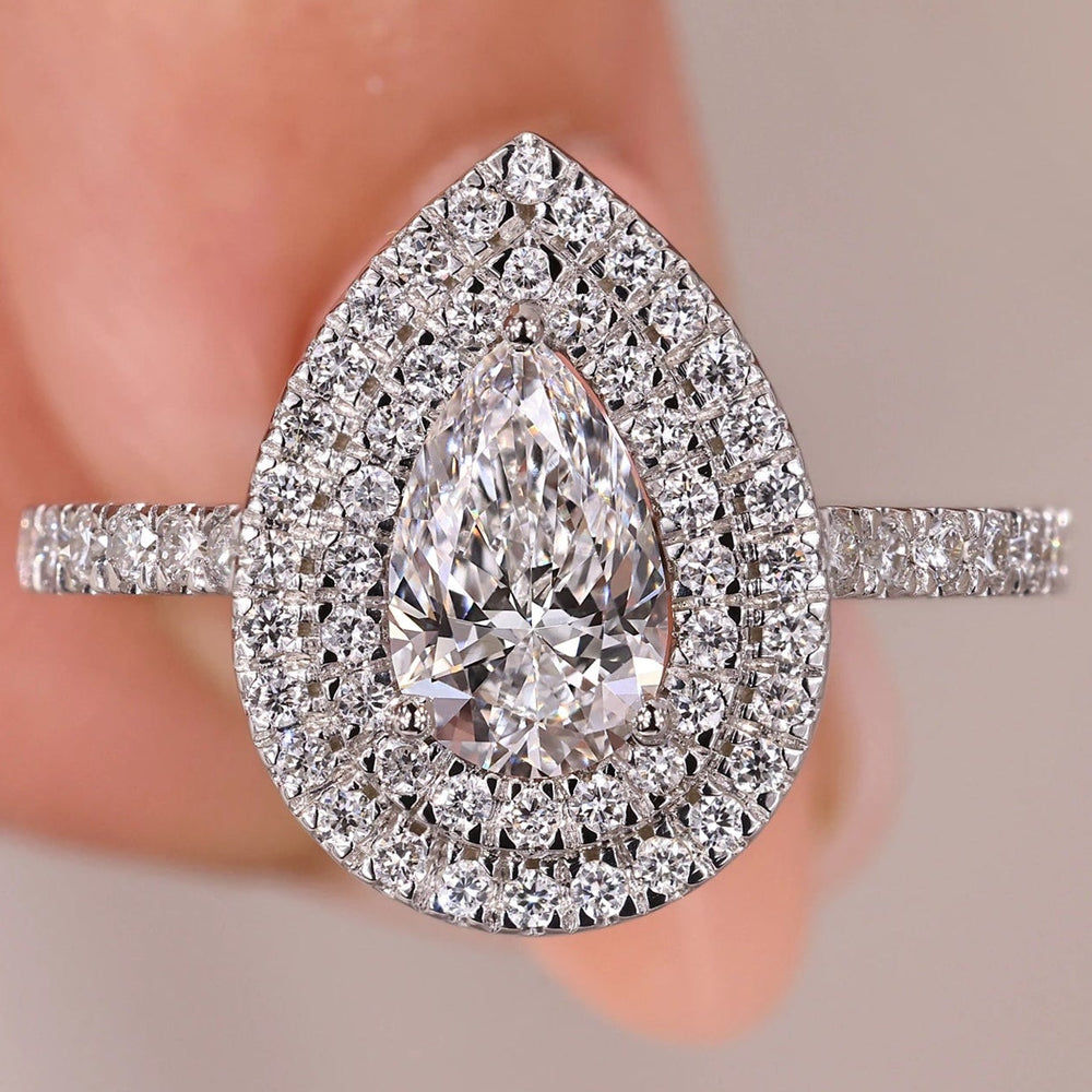 Pear shaped engagement ring featuring a dazzling double halo.
