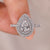 Pear shaped engagement ring featuring a dazzling double halo.