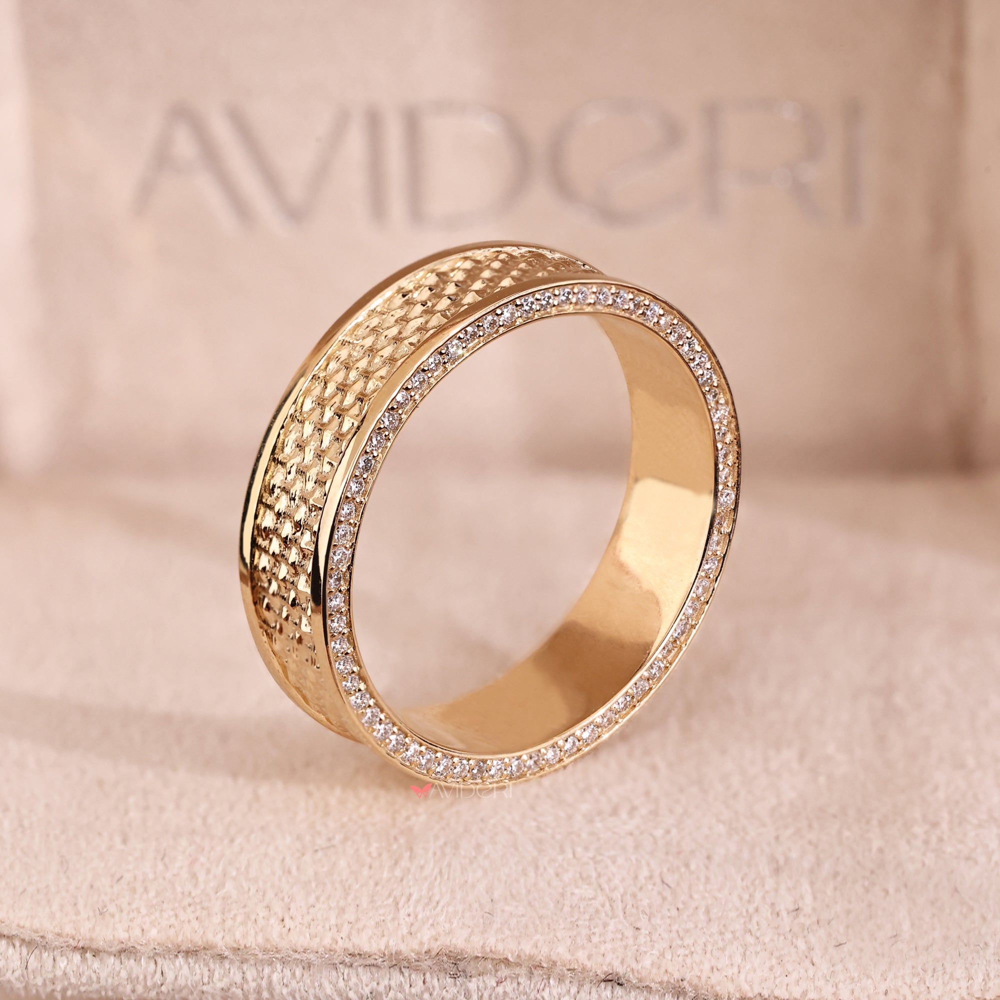 Double sided eternity band shows diamonds all around in yellow gold.