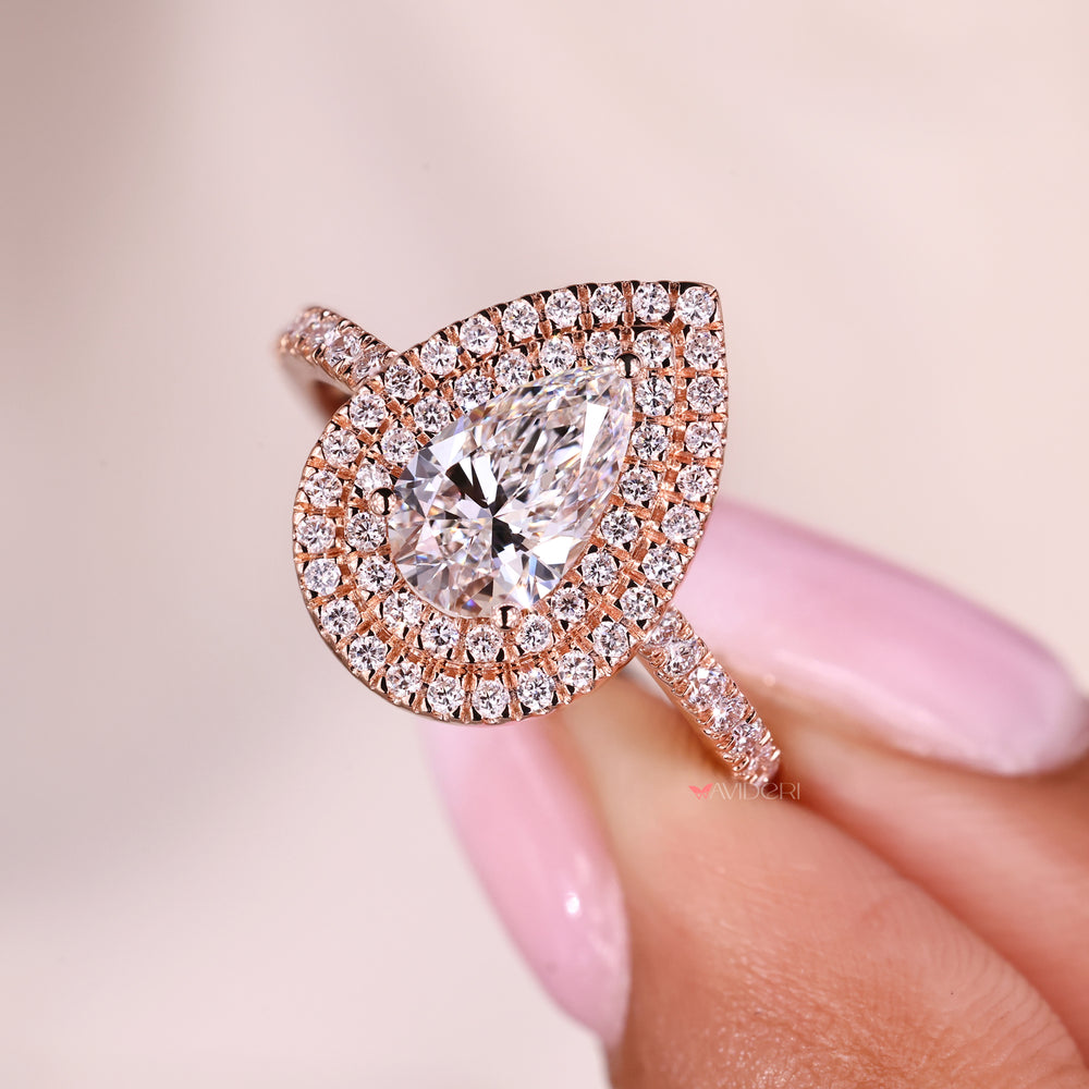 Three prong setting holding pear diamond securely.