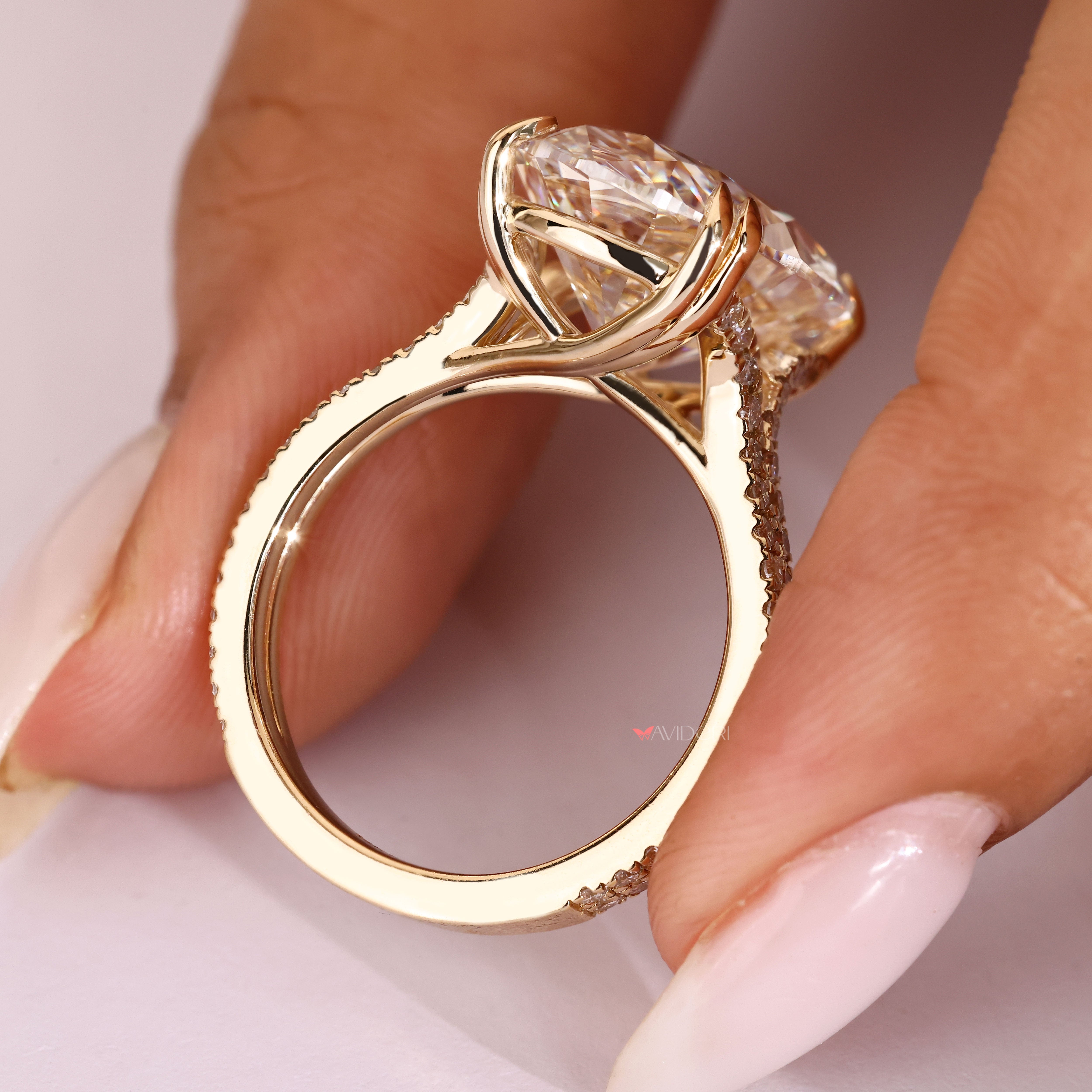 Handmade oval diamond ring with cathedral setting.
